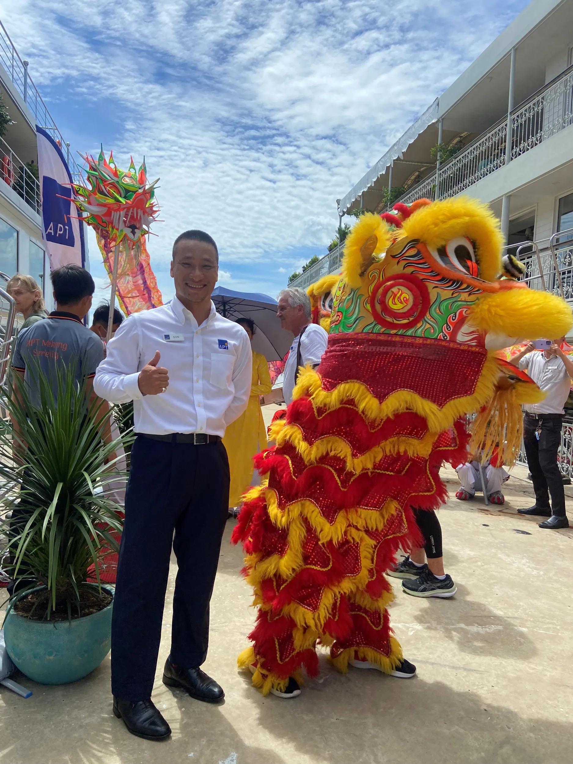 Tour Director Son Pham and Dragon at first sailing  of Mekong Serenity Vietnam