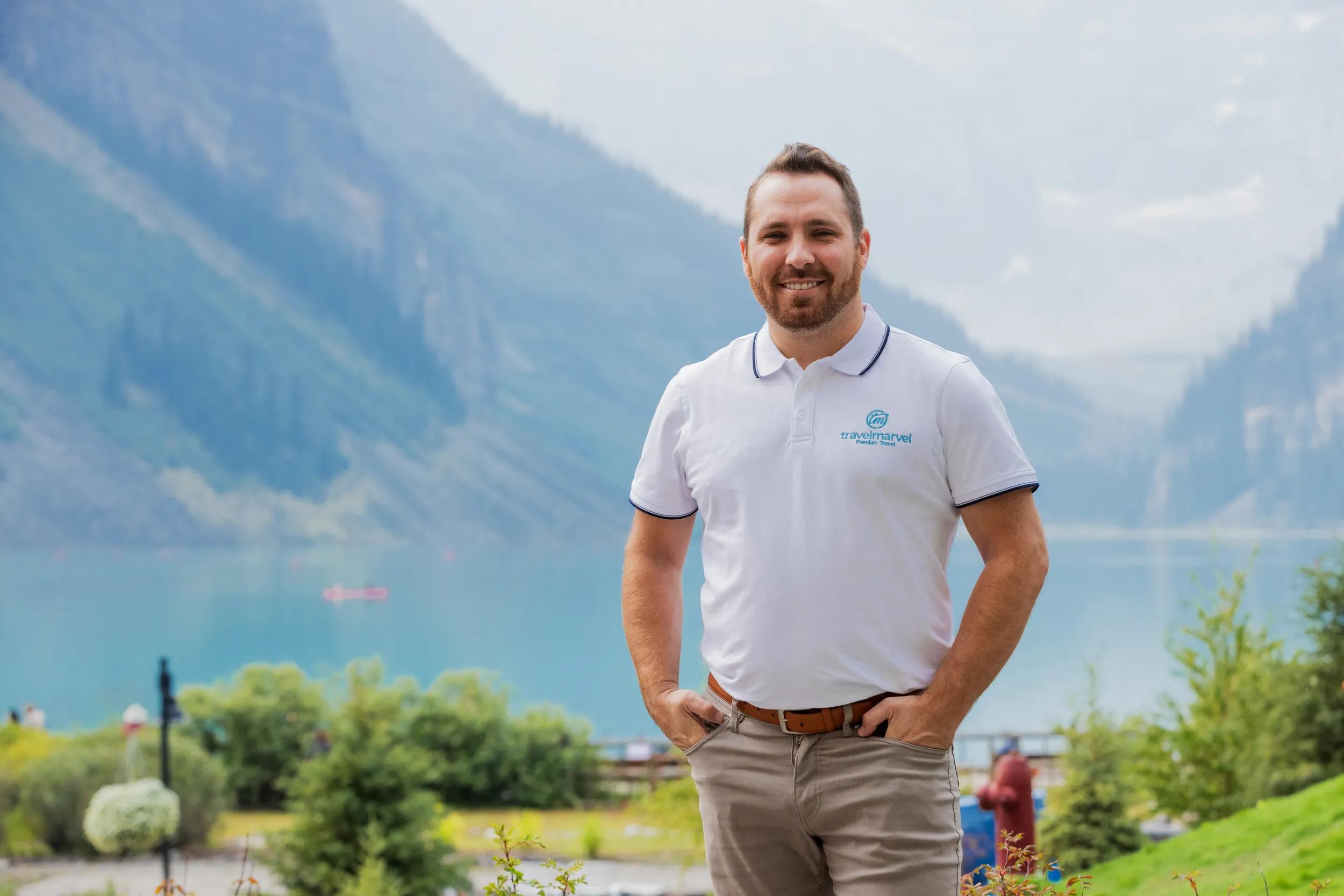 Tour Director Zac Watts in Travelmarvel uniform, Lake Louise, Canada.