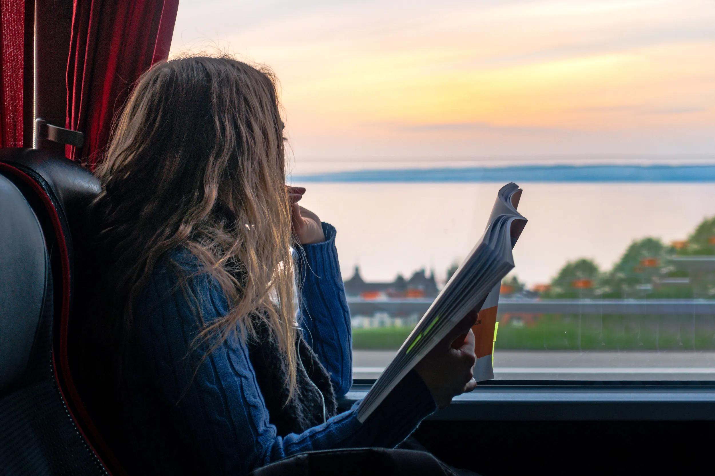 Girl Looking Out Window Reading Bus Sunset Landscape Peaceful Single