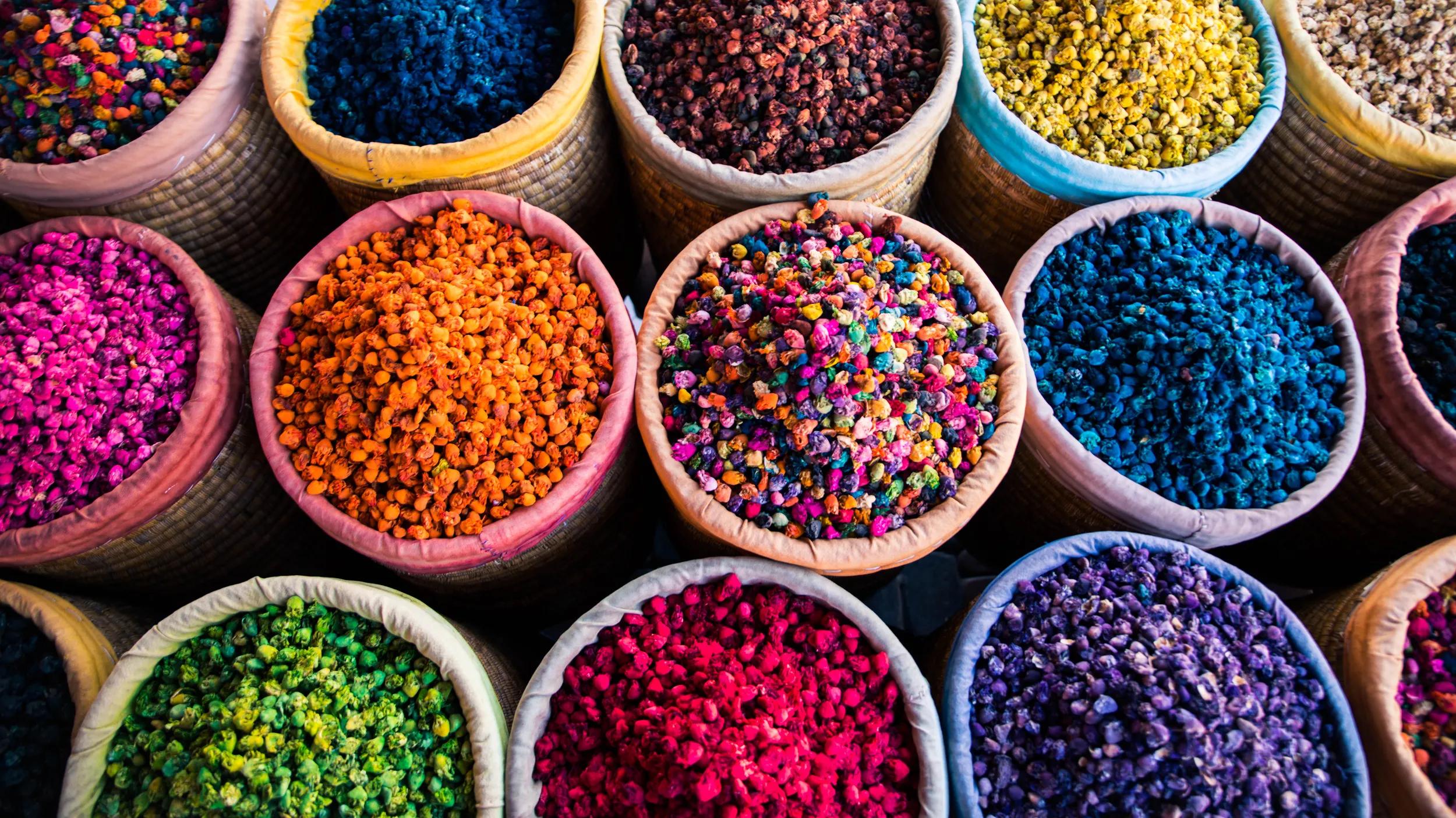 colourful spices in round baskets in the souk of marrakech