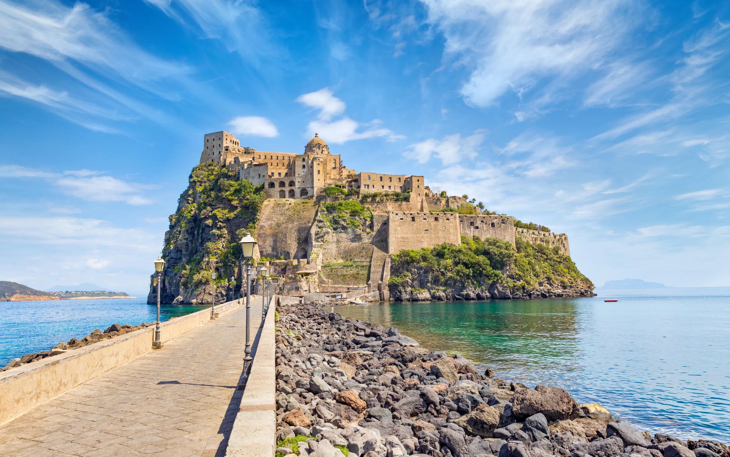 Daylight view road to Aragonese Castle or Castello Aragonese - famous landmark and tourist destination near Ischia island, Italy.