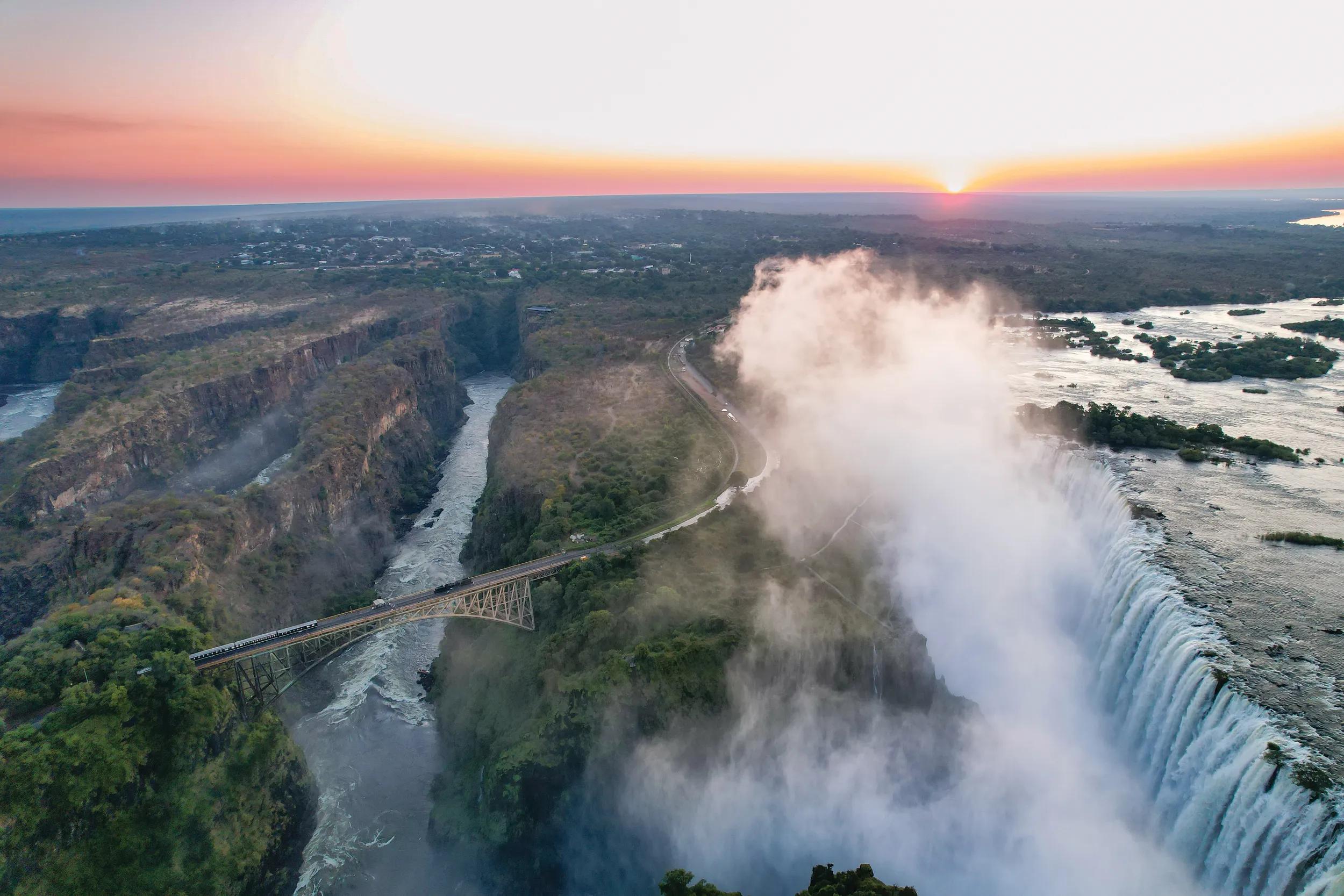 The Royal Livingstone Express steam train on Victoria Falls Bridge, Zambia.