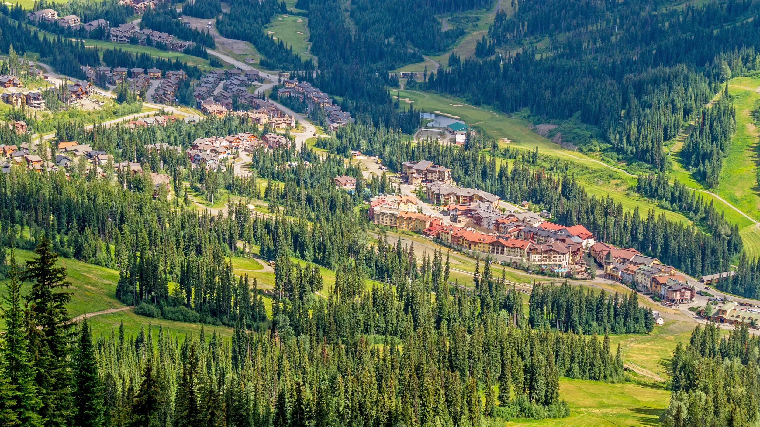 Sun Peaks Village nestled in Central British Columbia as seen from the Chairlift going up Tod mountain in Summer.