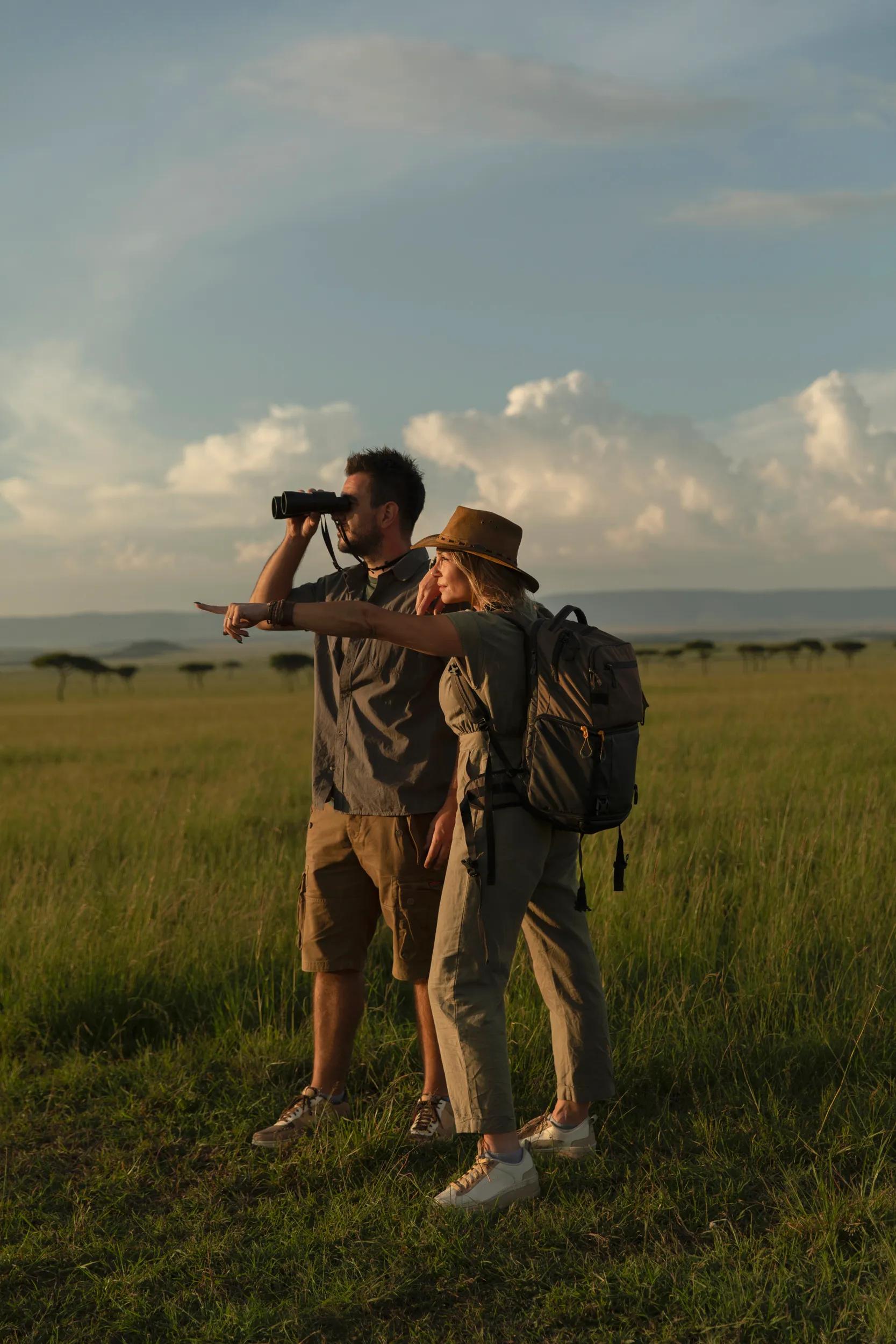 The couple ventures into the safari, armed with binoculars for wildlife spotting