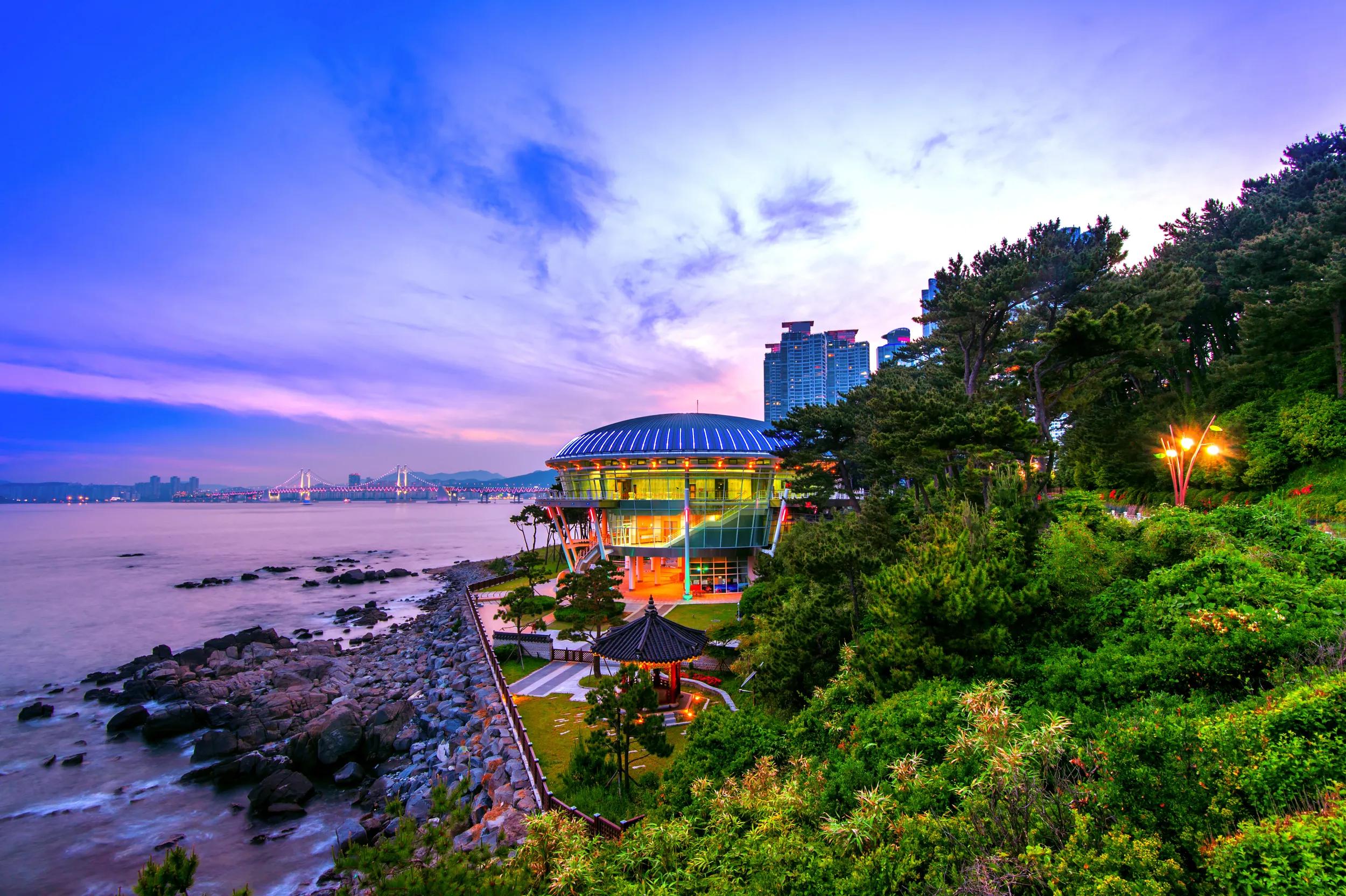Dongbaek island with Nurimaru APEC House and Gwangan bridge at sunset in Busan,South Korea