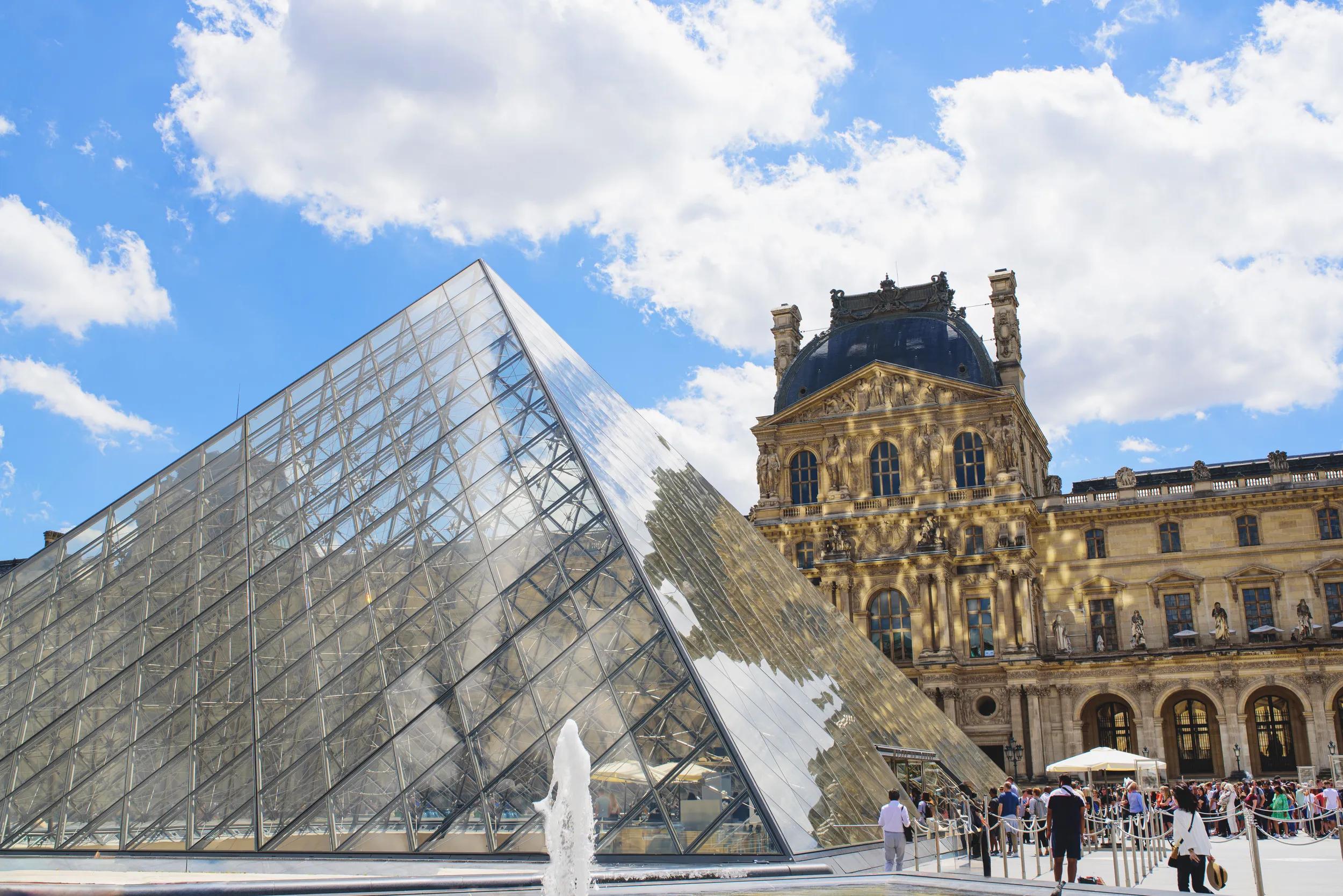 The Louvre Museum on a sunny day, the world's largest art museum and a historic monument in Paris, France.