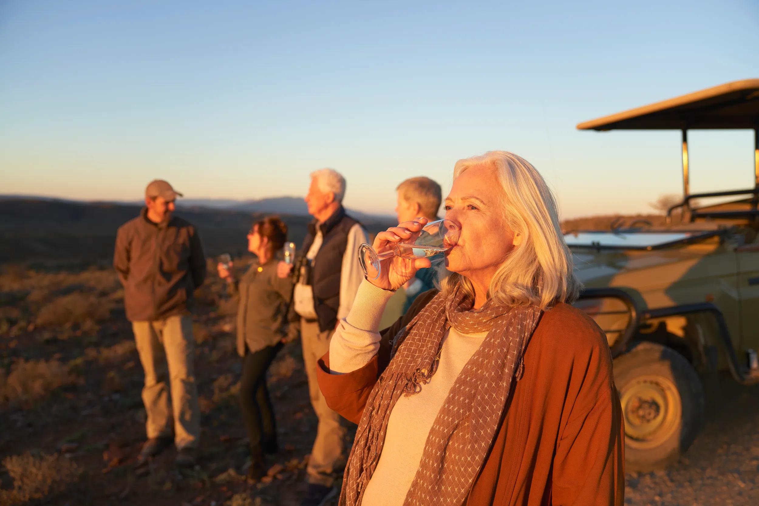 Generic group on safari at sunset