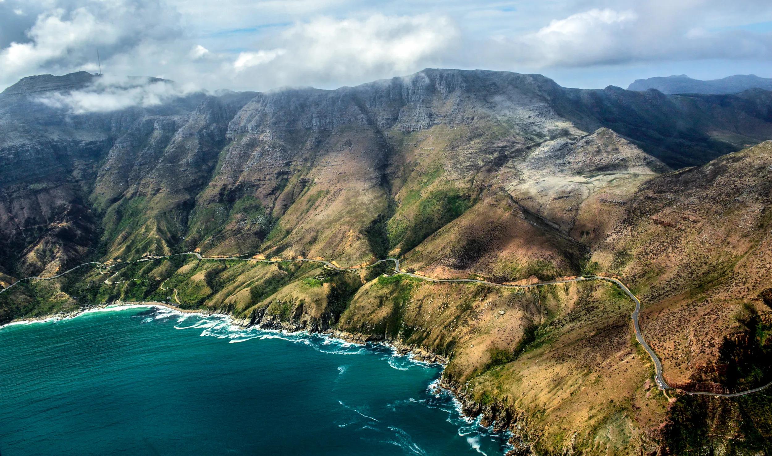 Aerial(Helicopter) view of south African coastline: chapman's peak drive near Cape Town and Cape of Good Hope