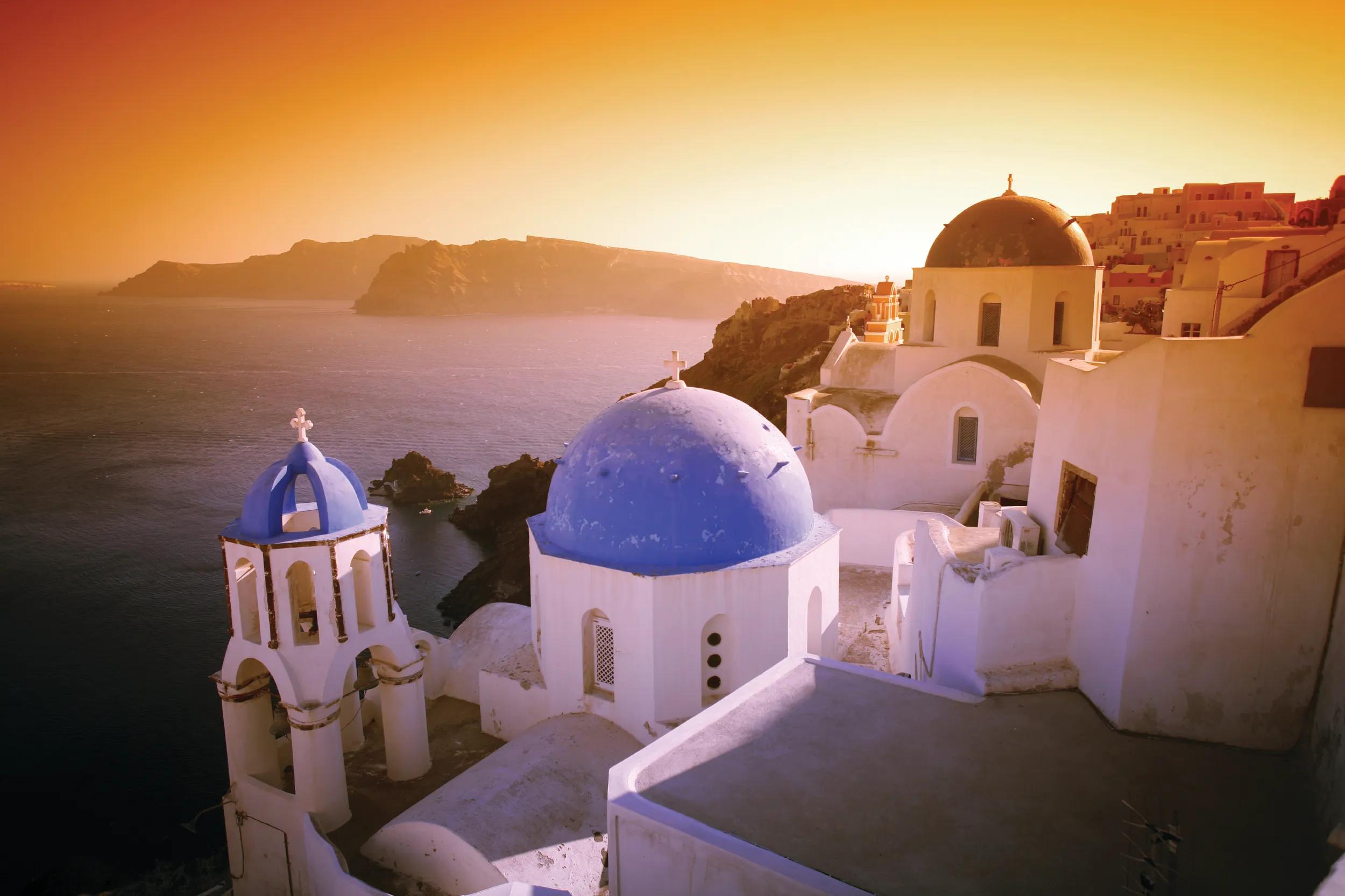 A surreal sunset effect over some of Santorini's world-famous churches.