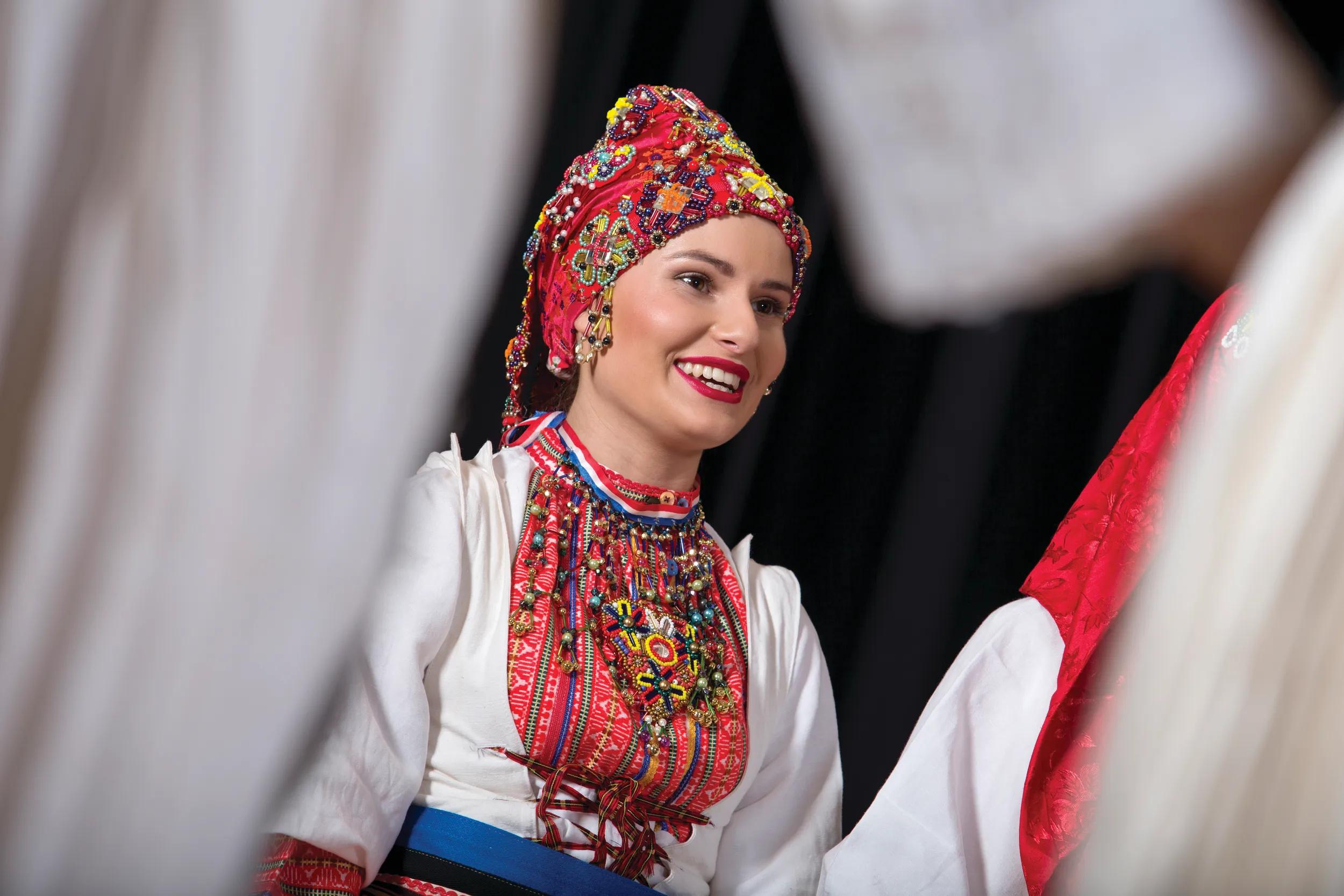 Portrait of female in Croatian folkloric dress posed for shot
