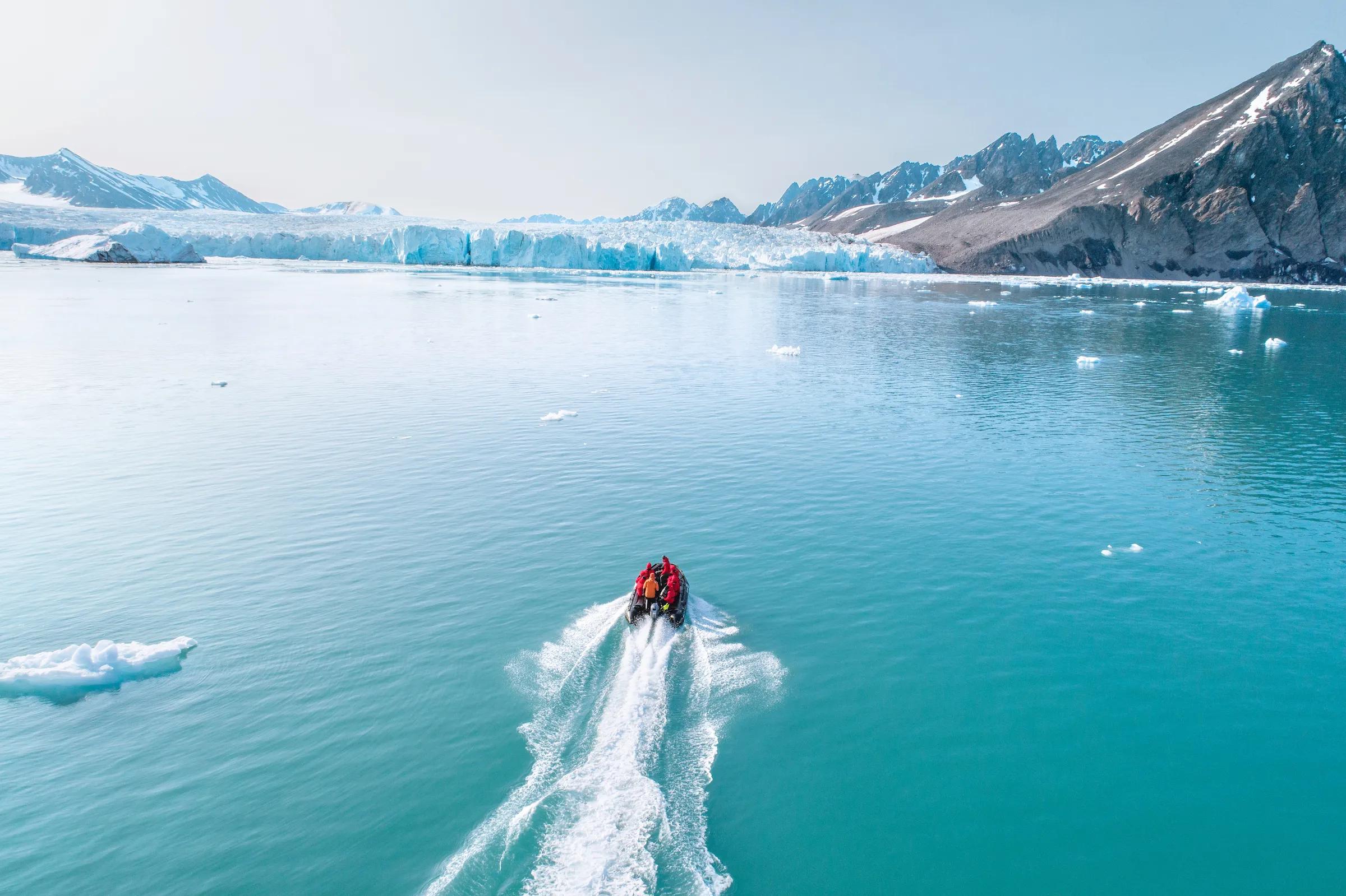 Guests on board of a zodiac, Monacobreen, Svalbard.