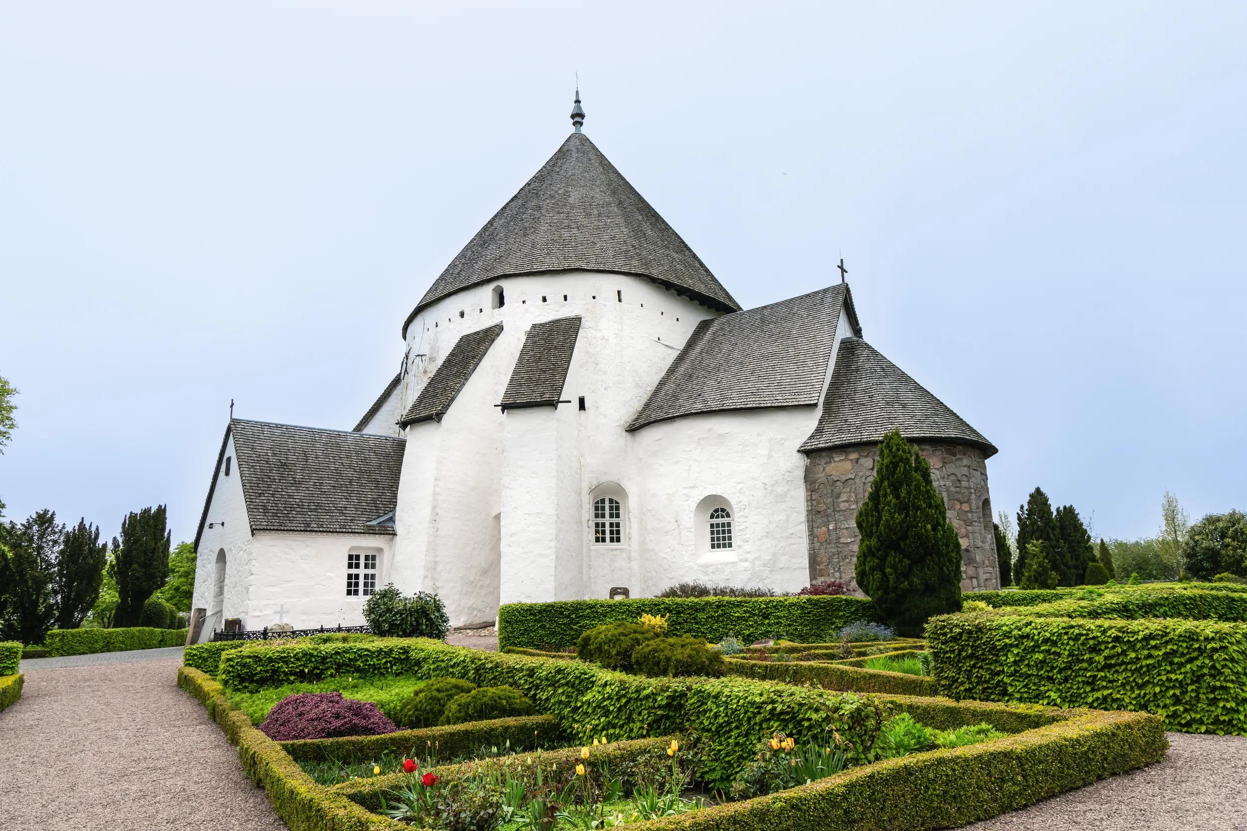 White round Osterlars church on the island of Bornholm. Concept of historical building and landmarks of Denmark. 
