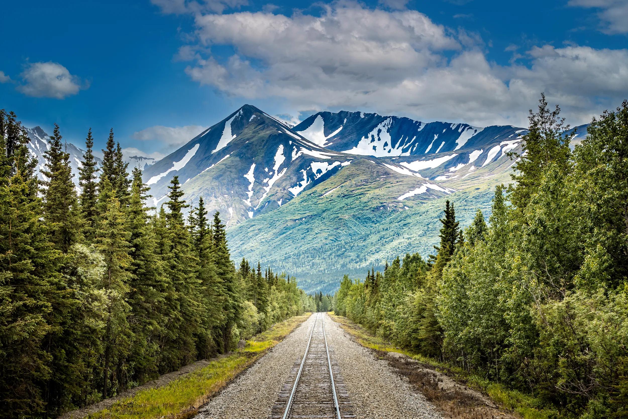 Railroad to Denali National Park, Alaska with impressive mountains.