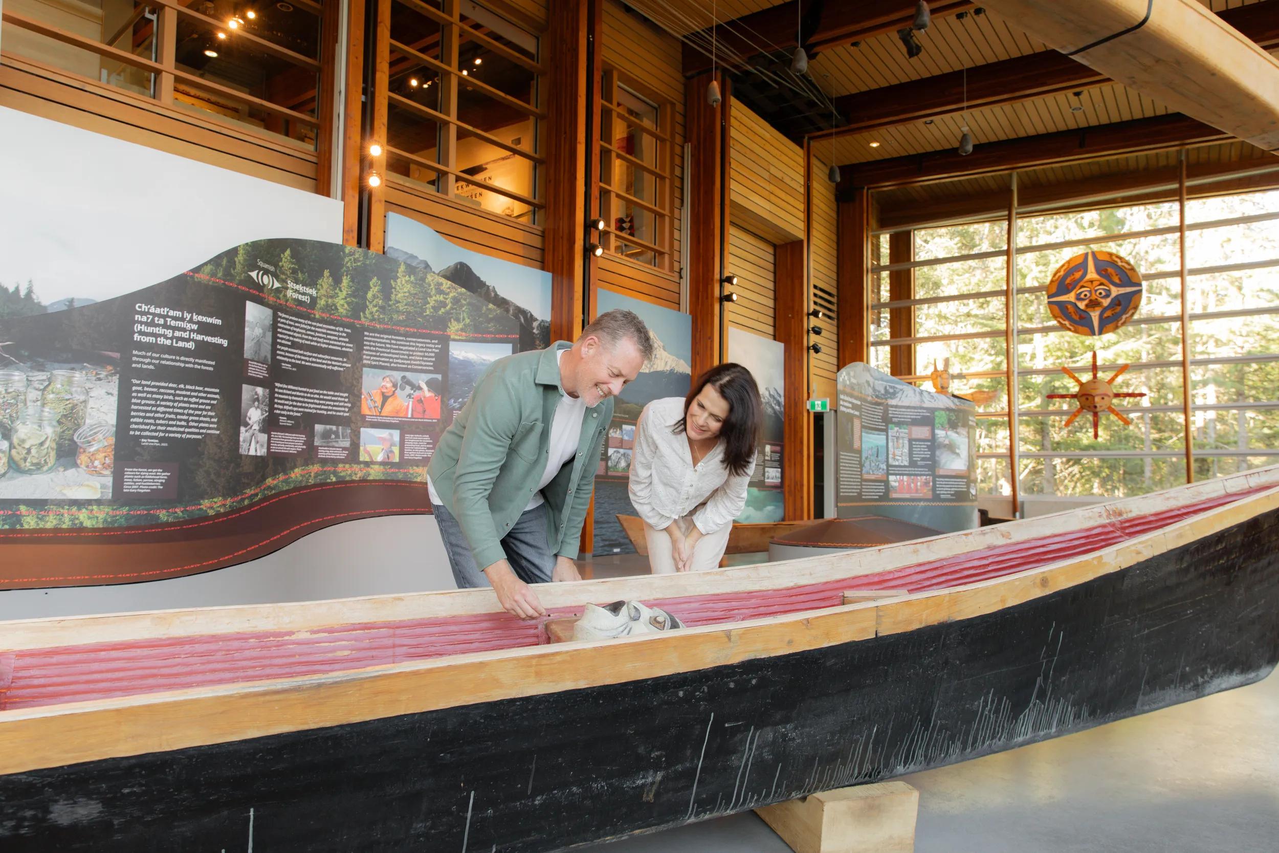 Couple experience the Squamish Lil'wat Cultural Centre, Whistler, Canada.