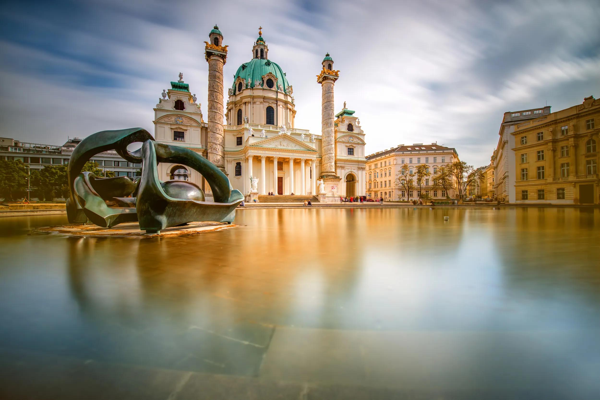 View on st. Charles's church on Karlsplatz in Vienna. Long exposure technic with blurred clouds and glossy water