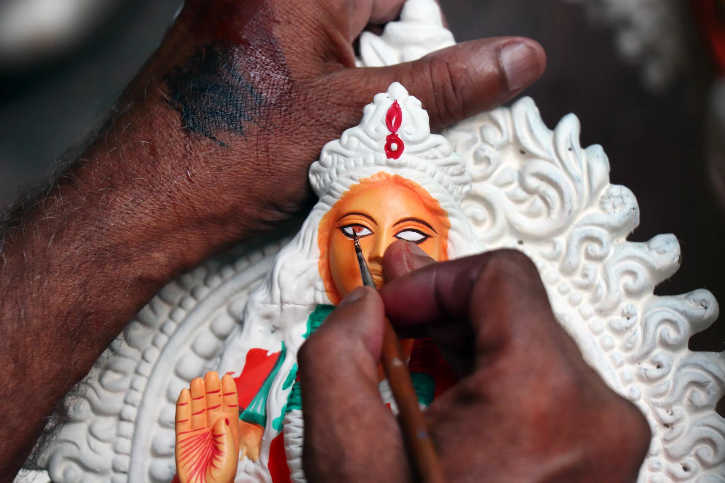Idol of Hindu Goddess Lakshmi during preparations in Kolkata. Clay idol of Goddess Lakshmi, under preparation for Bengal`s Lakshmi Puja festival at Kumartuli Kolkata