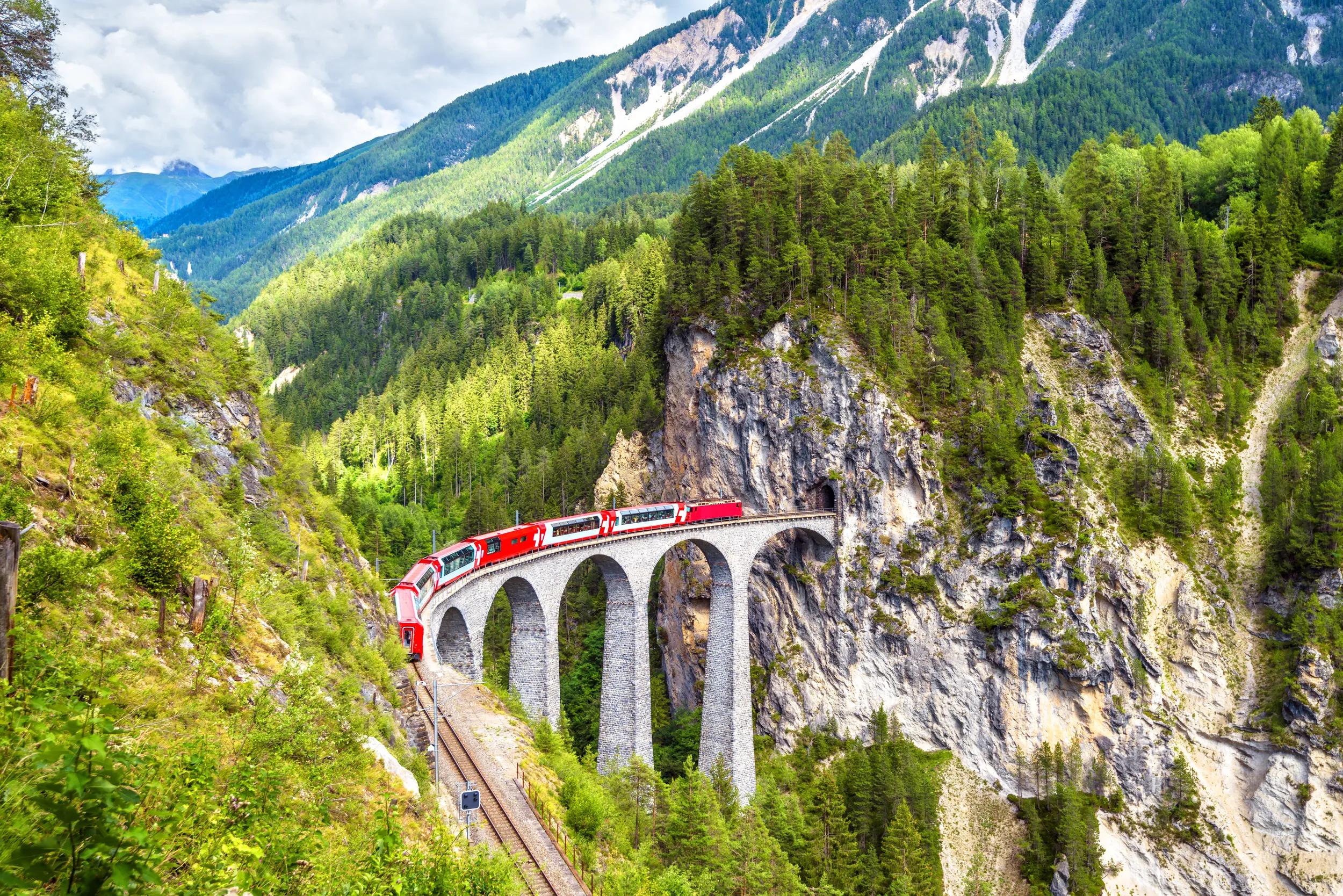 Glacier Express train on the Landwasser Viaduct in summer, Filisur, Switzerland.