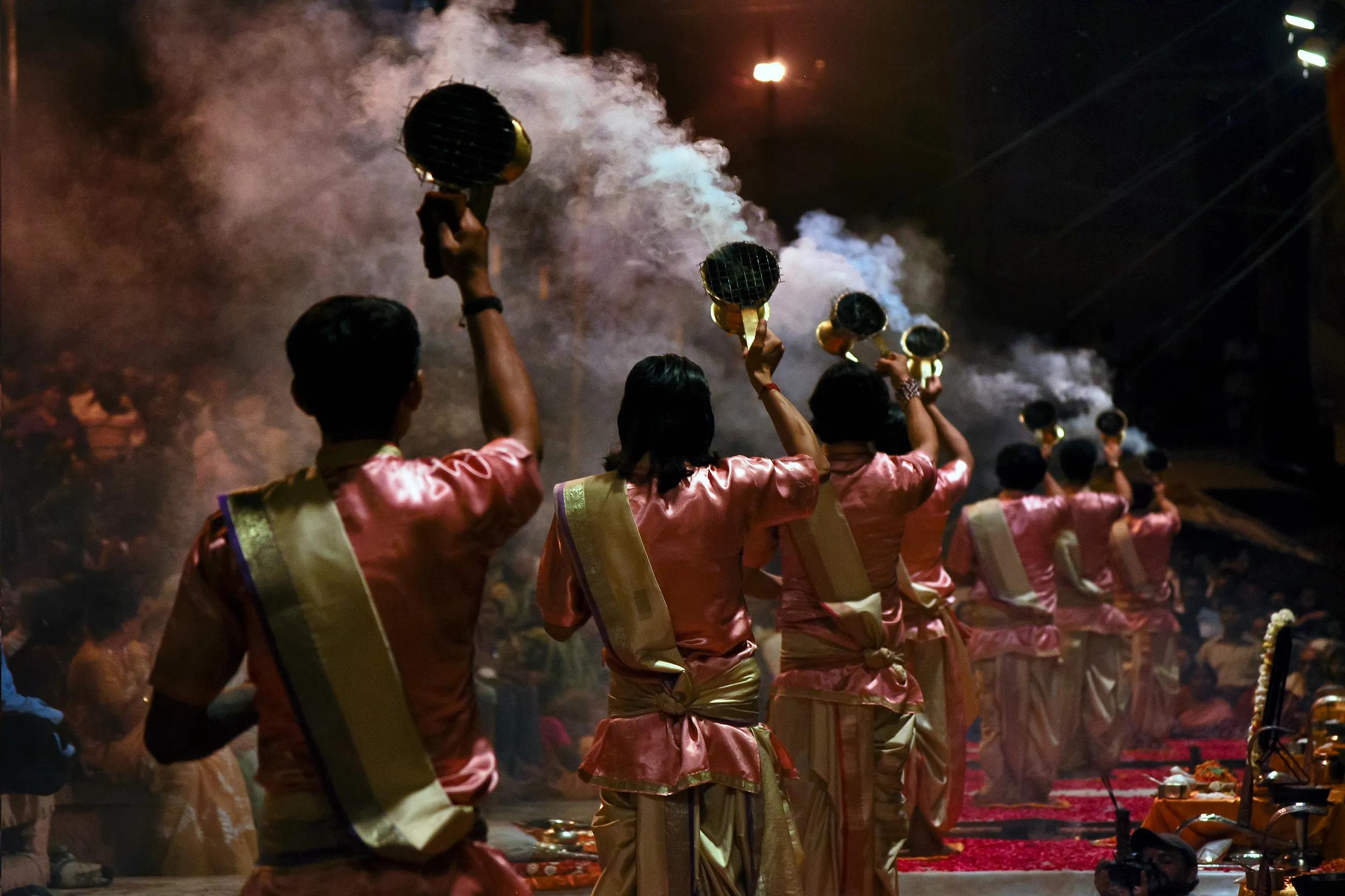 Priests performs Arti ritual at Dasaswamedh Ghat on edge of Ganges in Varanasi, India.