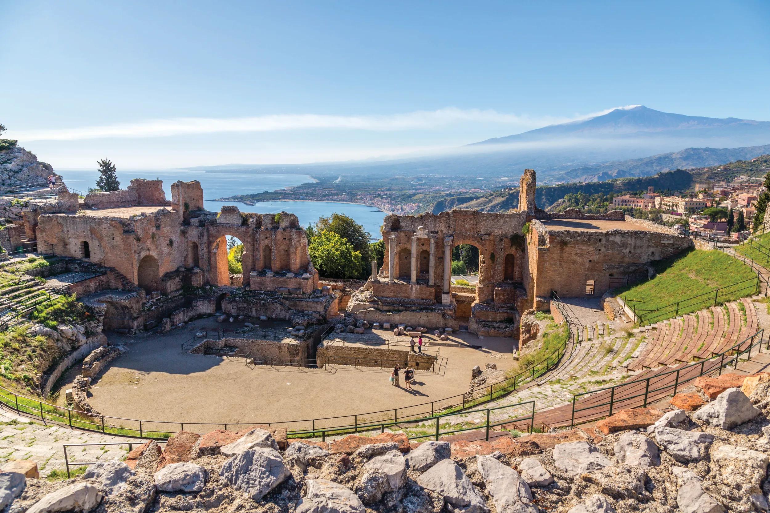 Mount Etna, Sicily, Italy, seen from the ruins of Greek Theatre in town of Taormina.