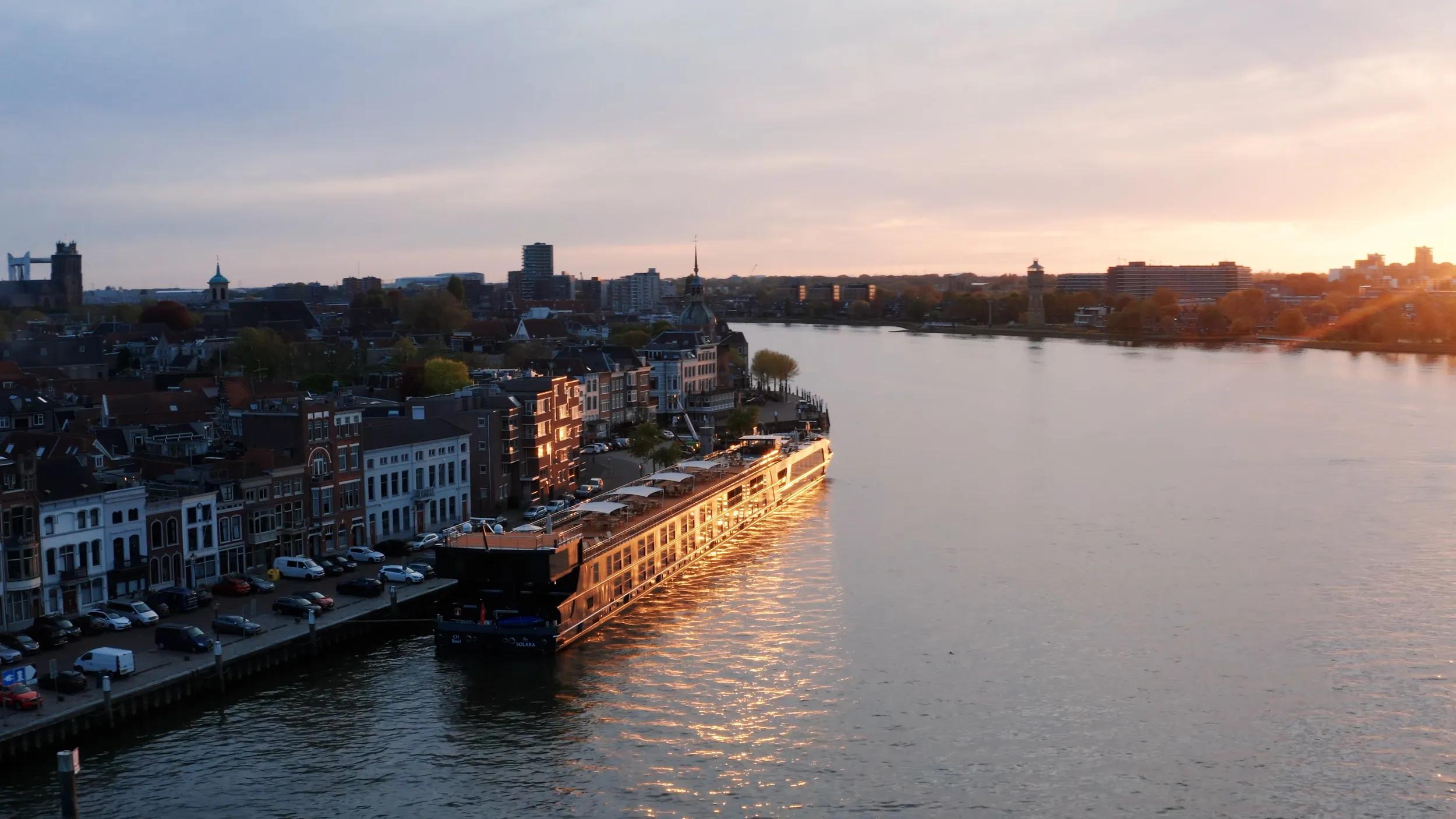 APT Solara ship aerial exterior at sunset at port in Dordrecht, Netherlands. Gruner Bar in raised position. (Still from drone)