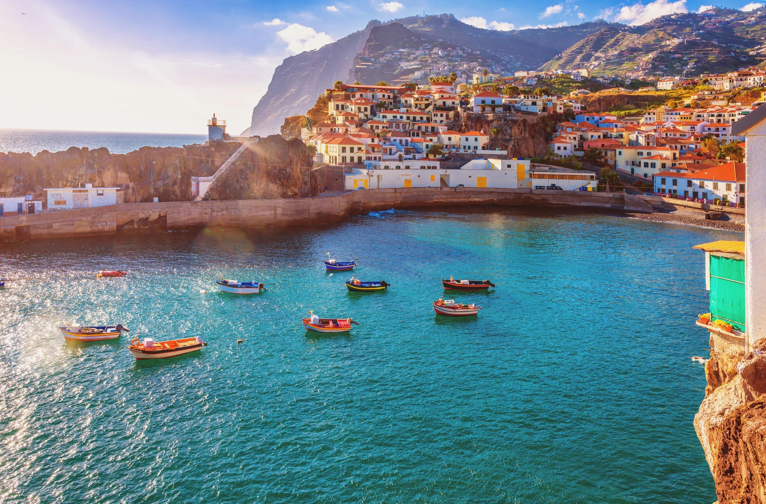 The beautiful fishing village of Camara de Lobos on the portugese Island of Madeira in warm evening sunshine light.