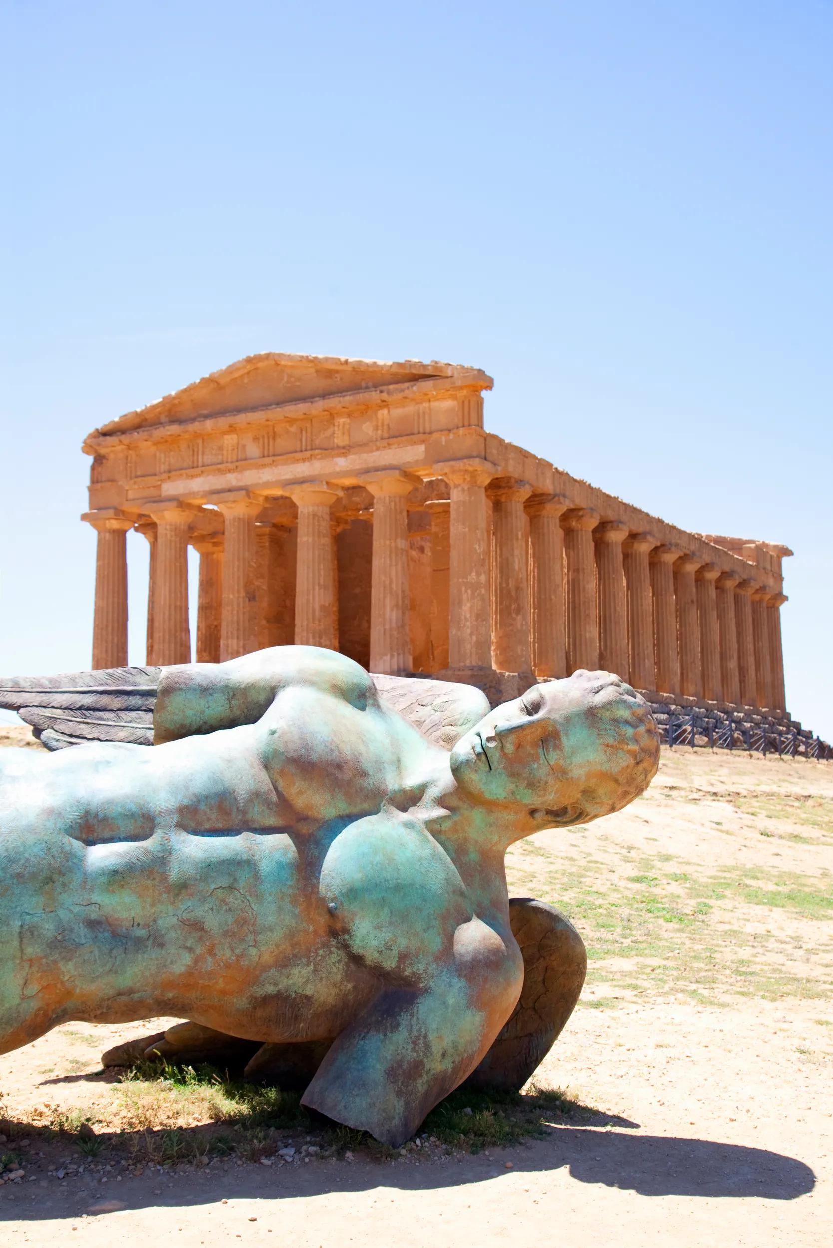 Roman ruins with bronze statue. Temple of Concordia