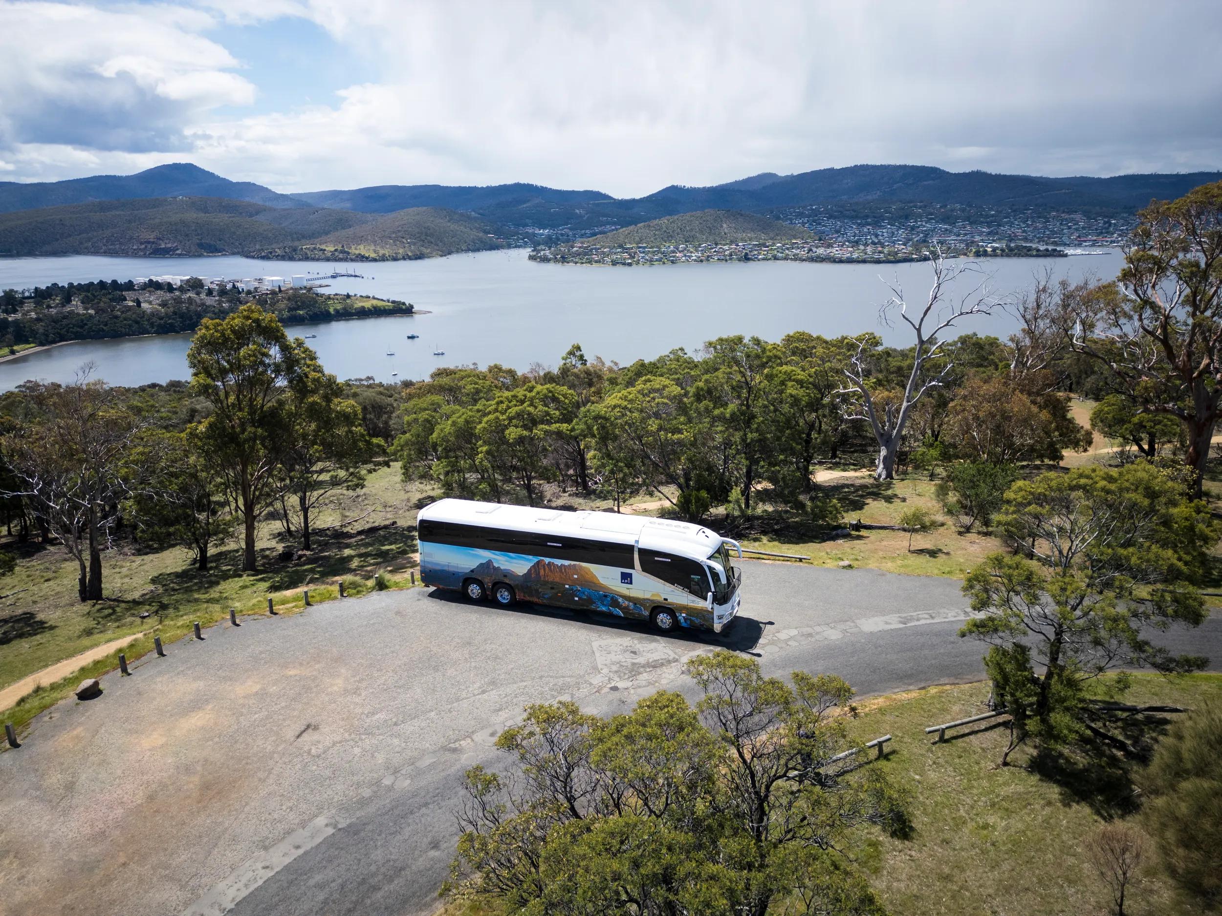 Aerial side view of APT coach - Kinetic partners with APT Travel Group with a new look coach in Hobart, Tasmania.