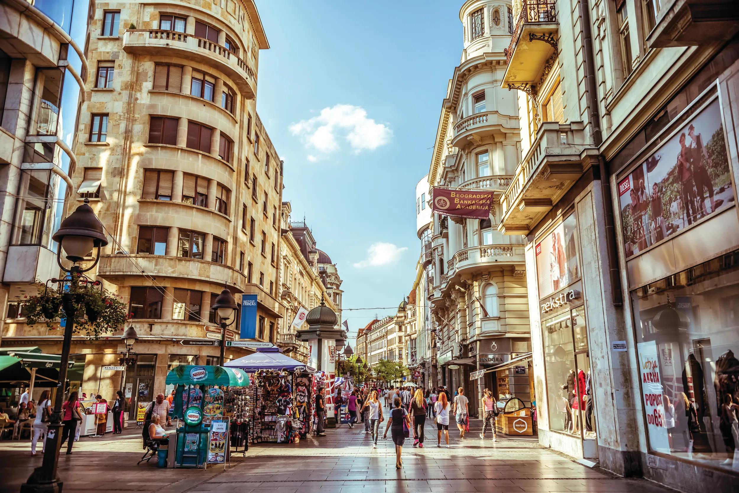Belgrade, Serbia - September 23, 2015: Knez Mihailova Street. Street is the main shopping mile of Belgrade. Filtered photo with warm summer lighting.