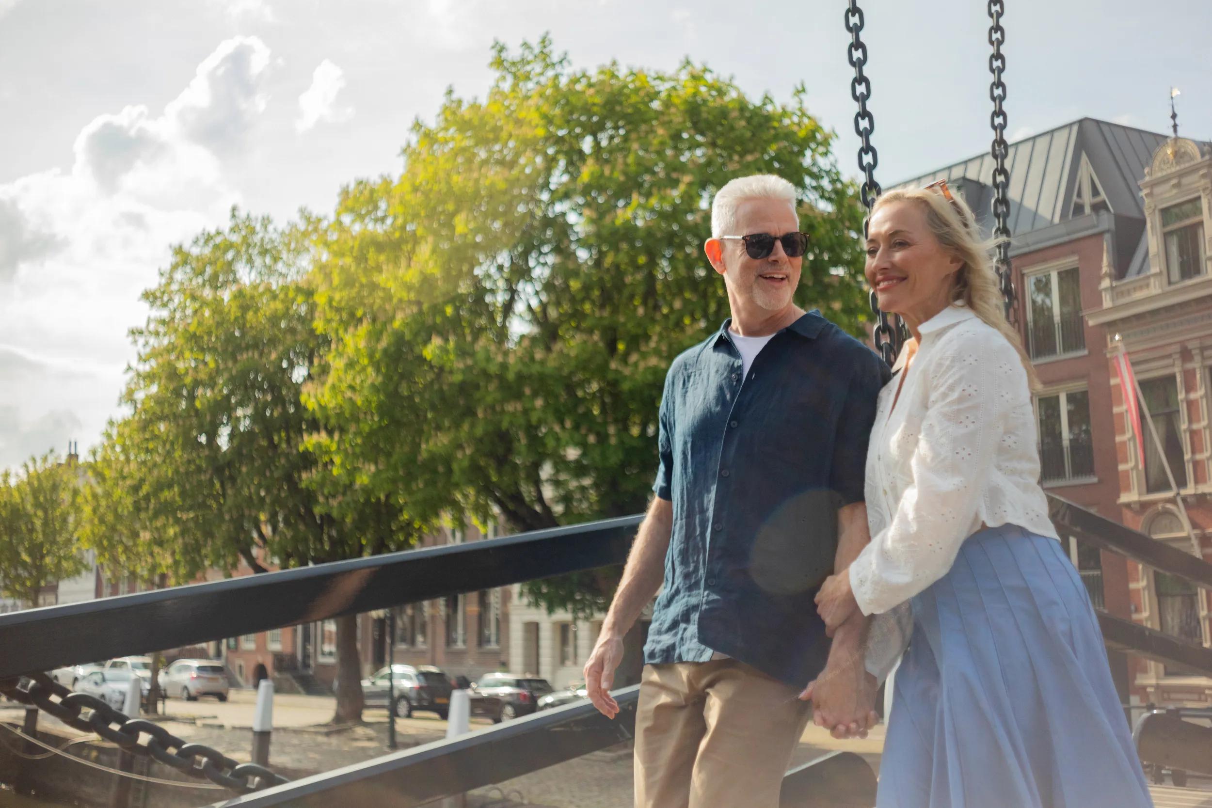 APT Solara, 2025 photoshoot, Lifestyle, Day Trip. Couple on the Damiate Bridge which spans the mouth of the Wolwevershaven harbor, in Dordrecht, Netherlands.