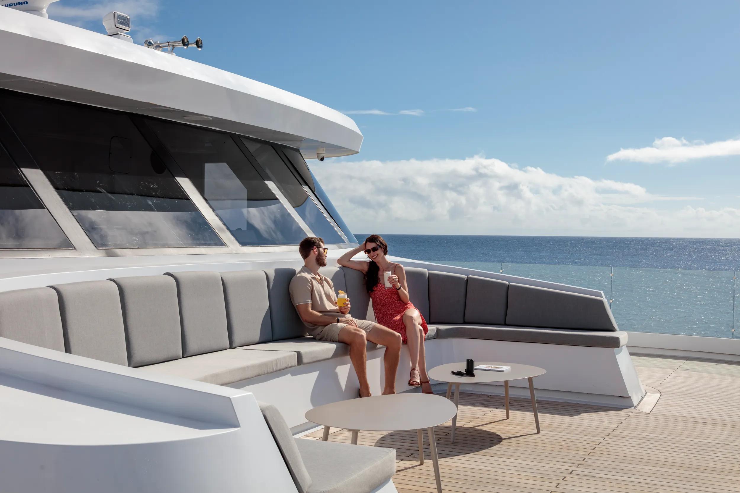 Hermes Galapagos Mega Catamaran couple on deck