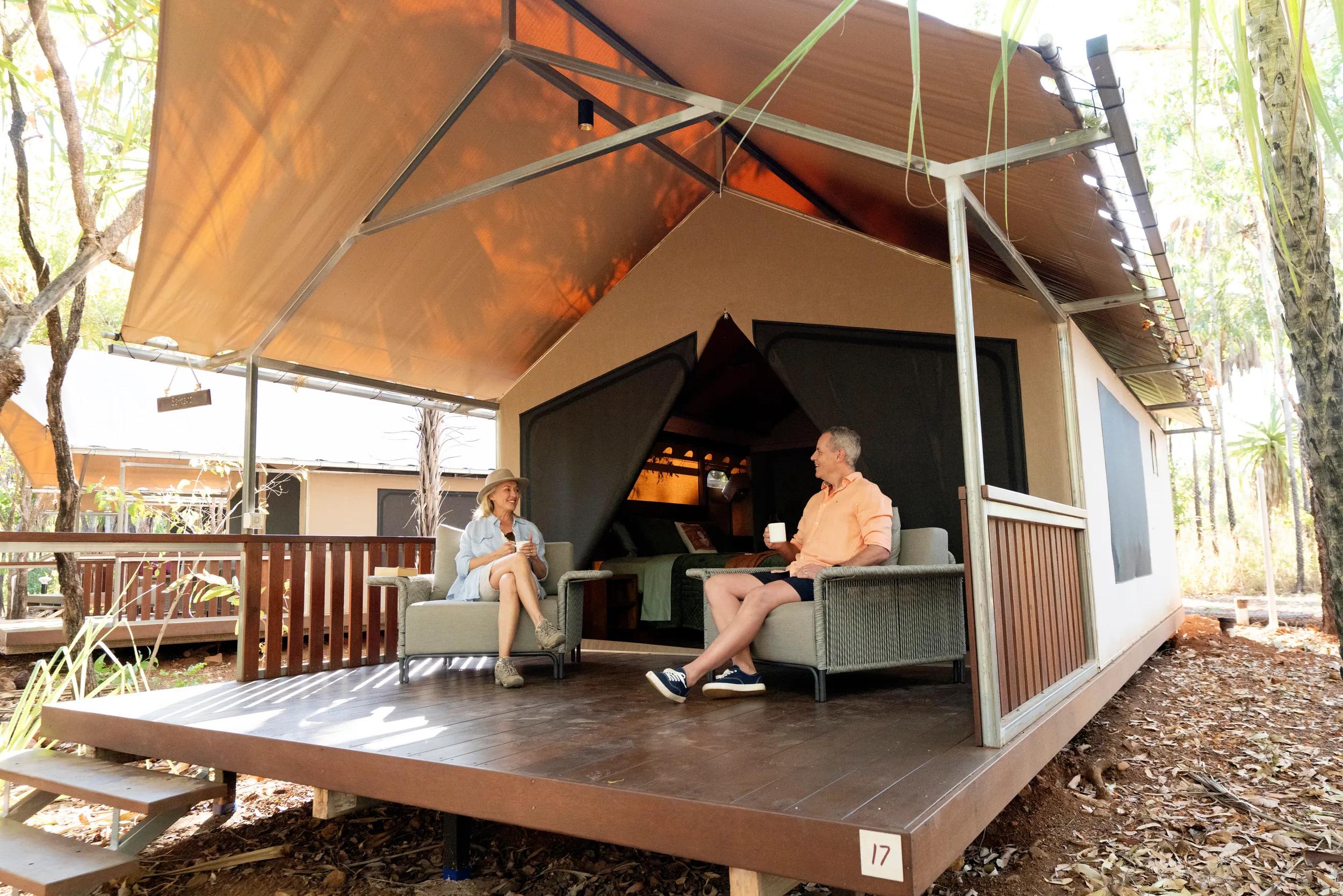 Lodge Accommodation - couple sitting on a deck - APT - Mitchell Falls photo shoot 2024.