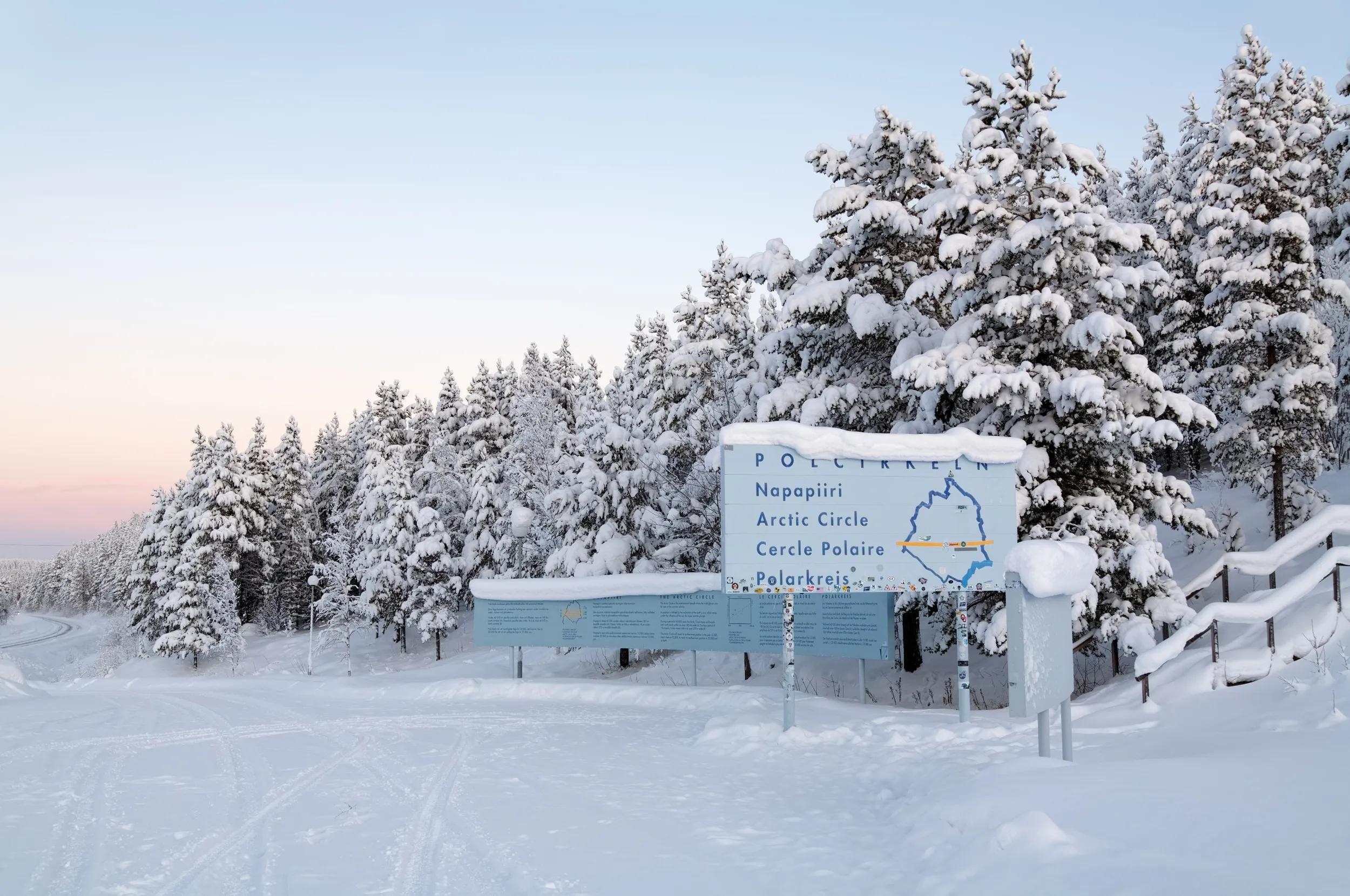 A snow covered sign in the Arctic Circle near Jokkmokk, Sweden.