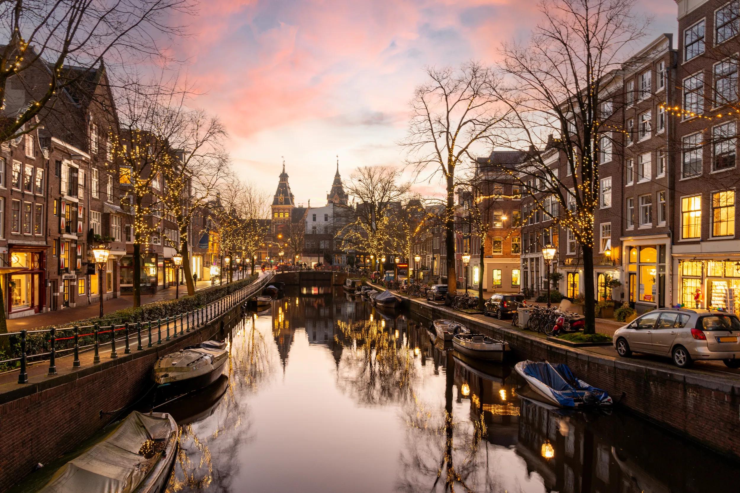 Christmas time at the Spiegelgracht in the old town of Amsterdam. On the horizon the towers the rijksmuseum.