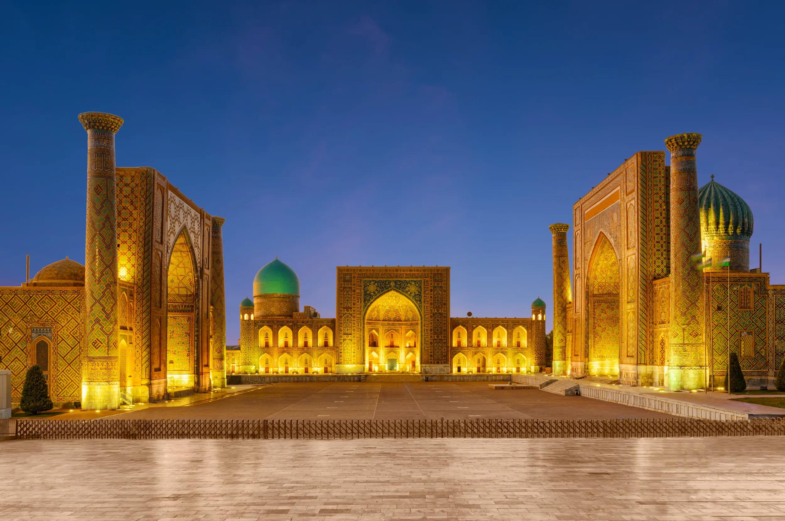Evening view of the Registan Square in Samarkand, Uzbekistan. The Ulugh Beg Madrasah, the Tilya-Kori Madrasah and the Sher-Dor Madrasah. The Registan is a popular tourist attraction of Central Asia.