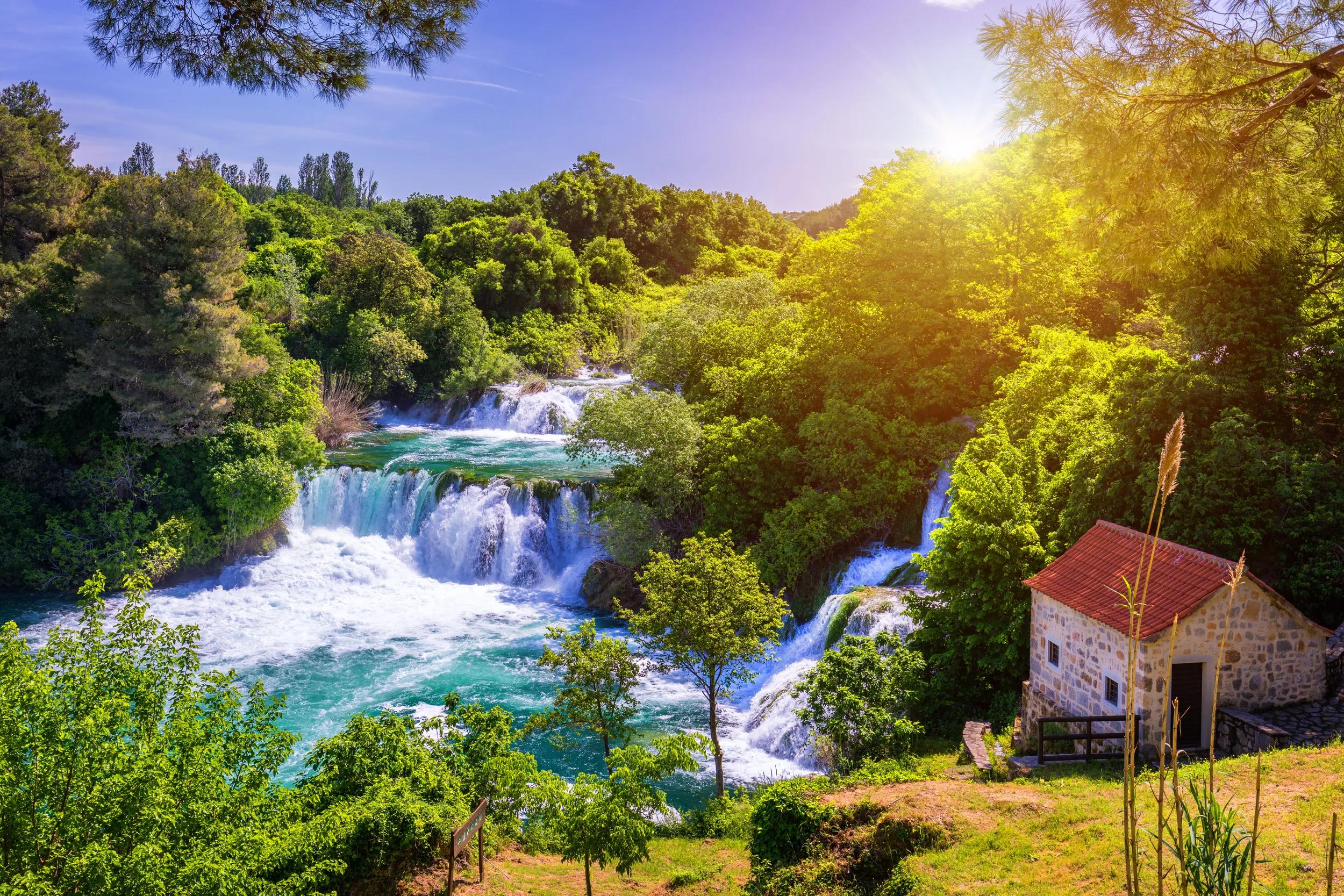 Waterfalls Krka, National Park, Dalmatia, Croatia. View of Krka National Park, Roski Slap location, Croatia, Europe. Beautiful world of Mediterranean countries. Traveling concept background.