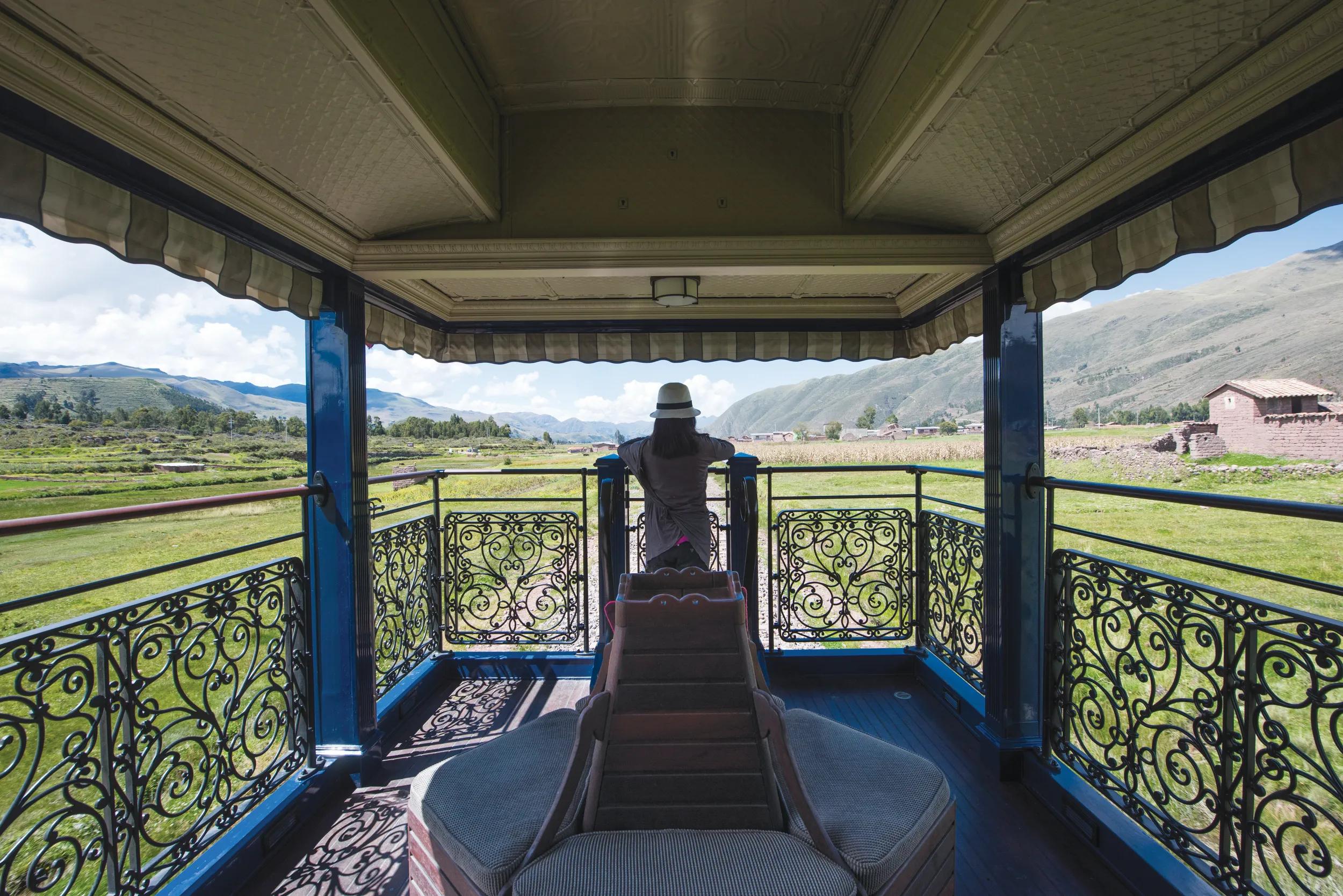 A passenger in the observation car as South America’s first luxury sleeper train, Belmond Andean Explorer, passes through the Cusco region of Peru, during its journey between Arequipa, Lake Titicaca and Cusco. The train cuts through some of the most breathtaking scenery in Peru and features 24 cabins, Peruvian cuisine by Executive Chef Diego Munoz, an elegant piano bar and outdoor observation car. Picture credit should read: Matt Crossick