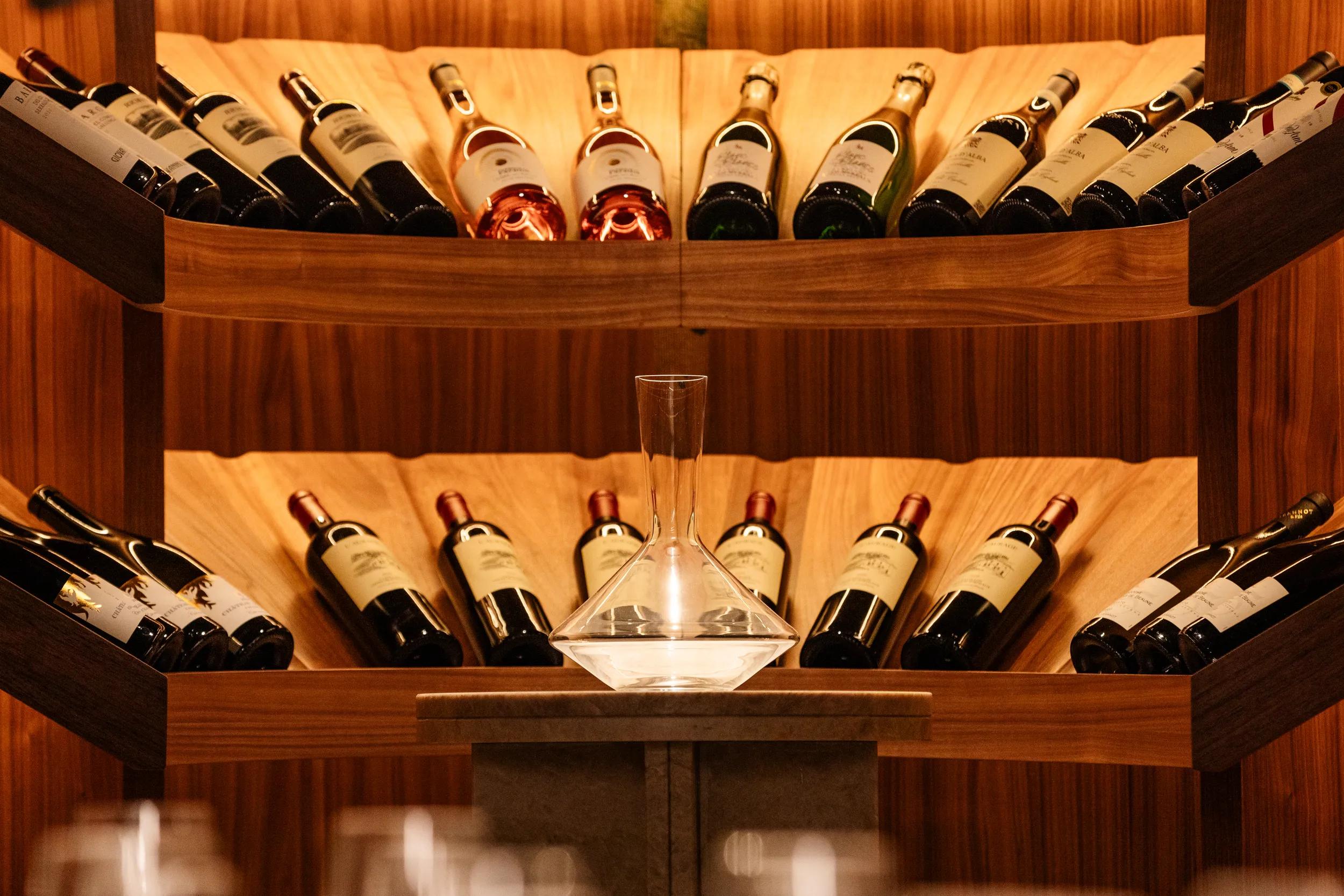 APT Solara photoshoot 2025, Owner's Cellar wine display.