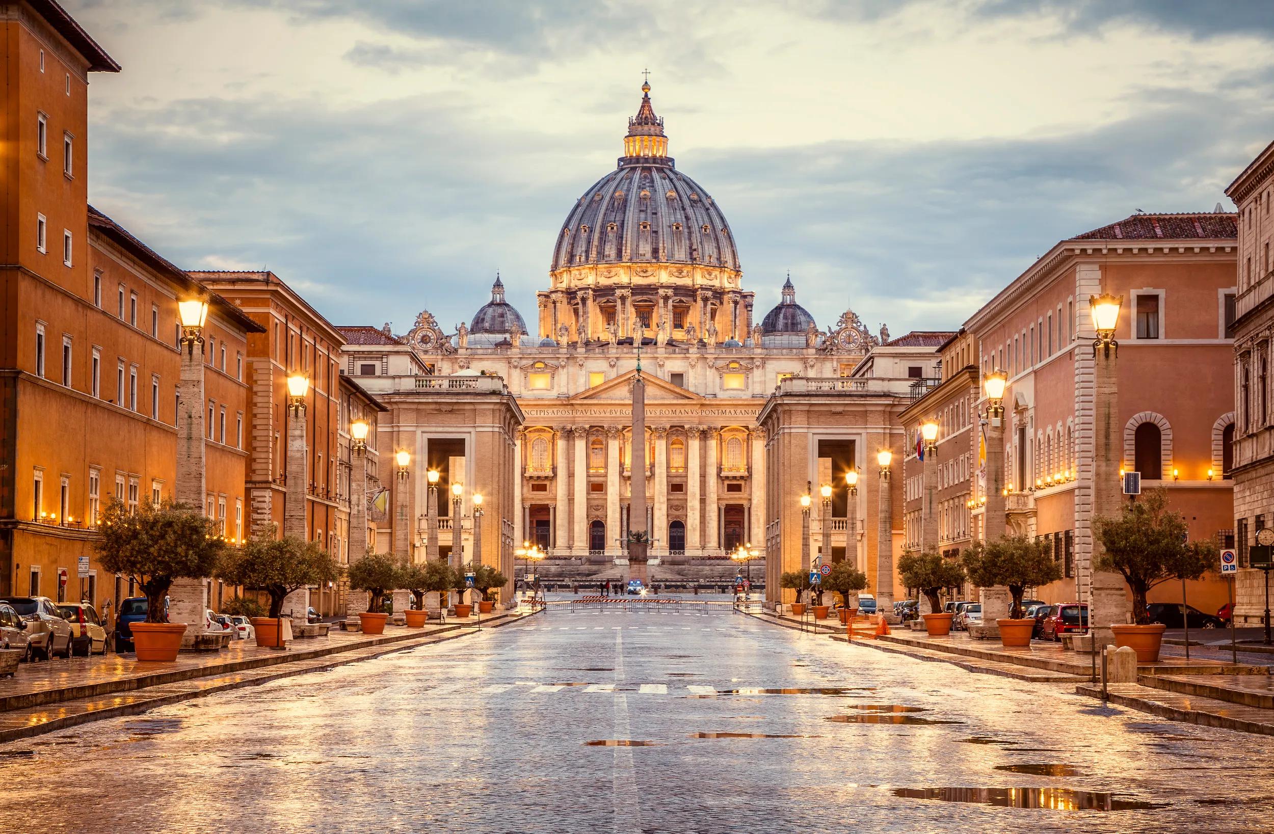 St. Peter's Basilica in the evening from Via della Conciliazione in Rome. Vatican City Rome Italy. Rome architecture and landmark.  St. Peter's cathedral in Rome. Italian Renaissance church.