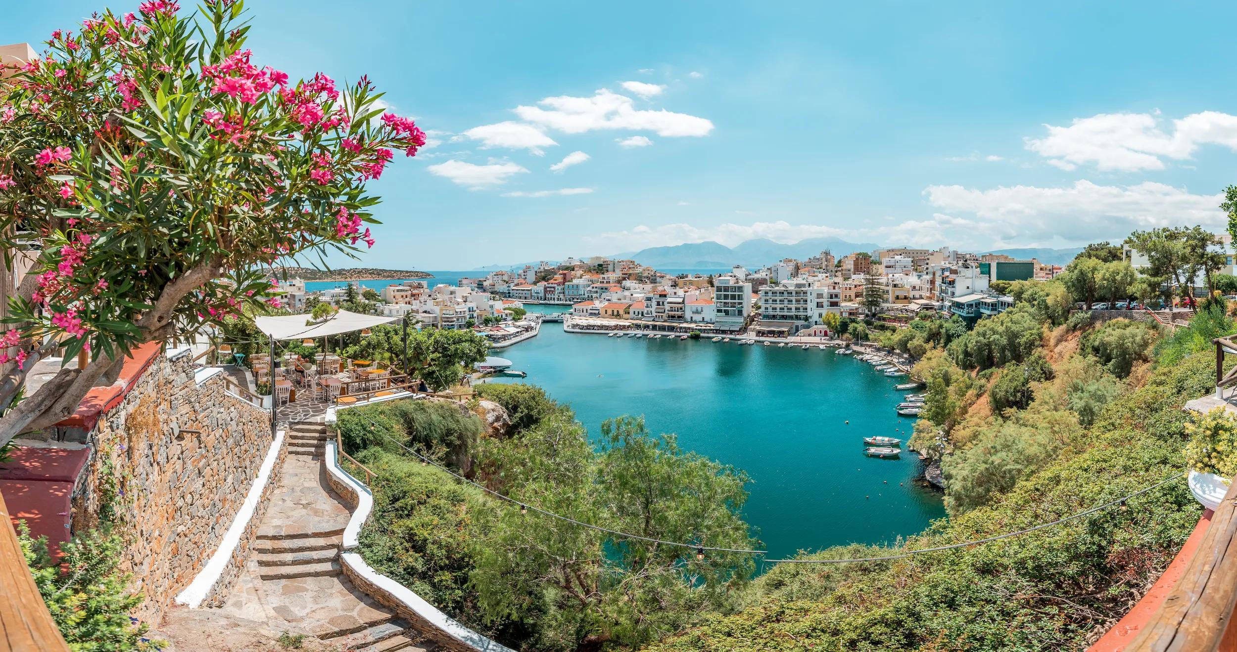 View over lake Voulismeni (Vouliagmeni) and the pittoresk harbour city, Agios Nikolaos, Crete, Greece.