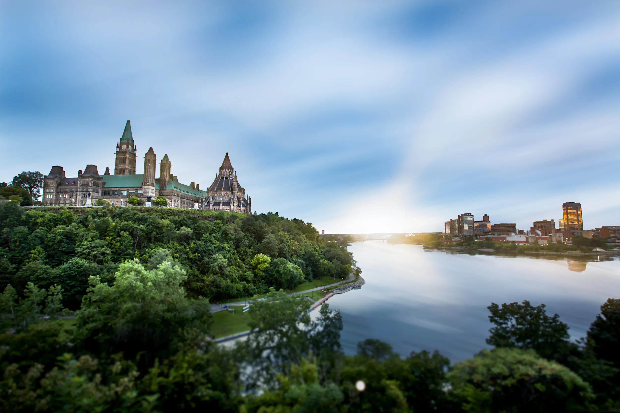 A landscape of Parliament Hill, Ottawa and Gatineau, Quebec, separated by the Ottawa River.