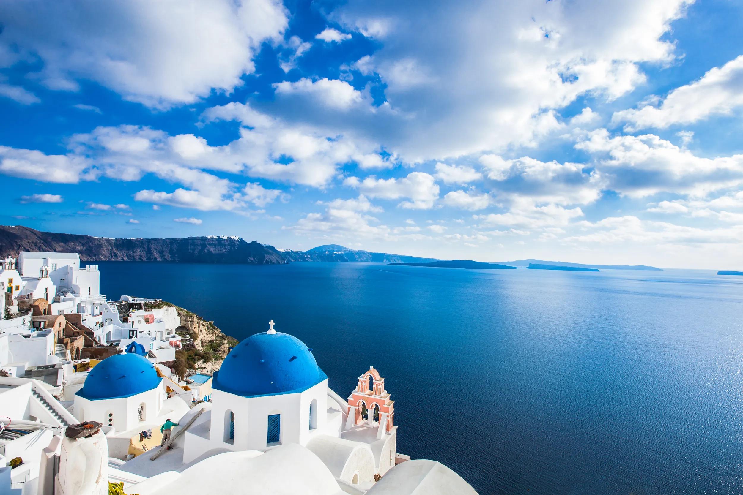 Famous blue domes of churches in Oia city on Santorini island, Greece