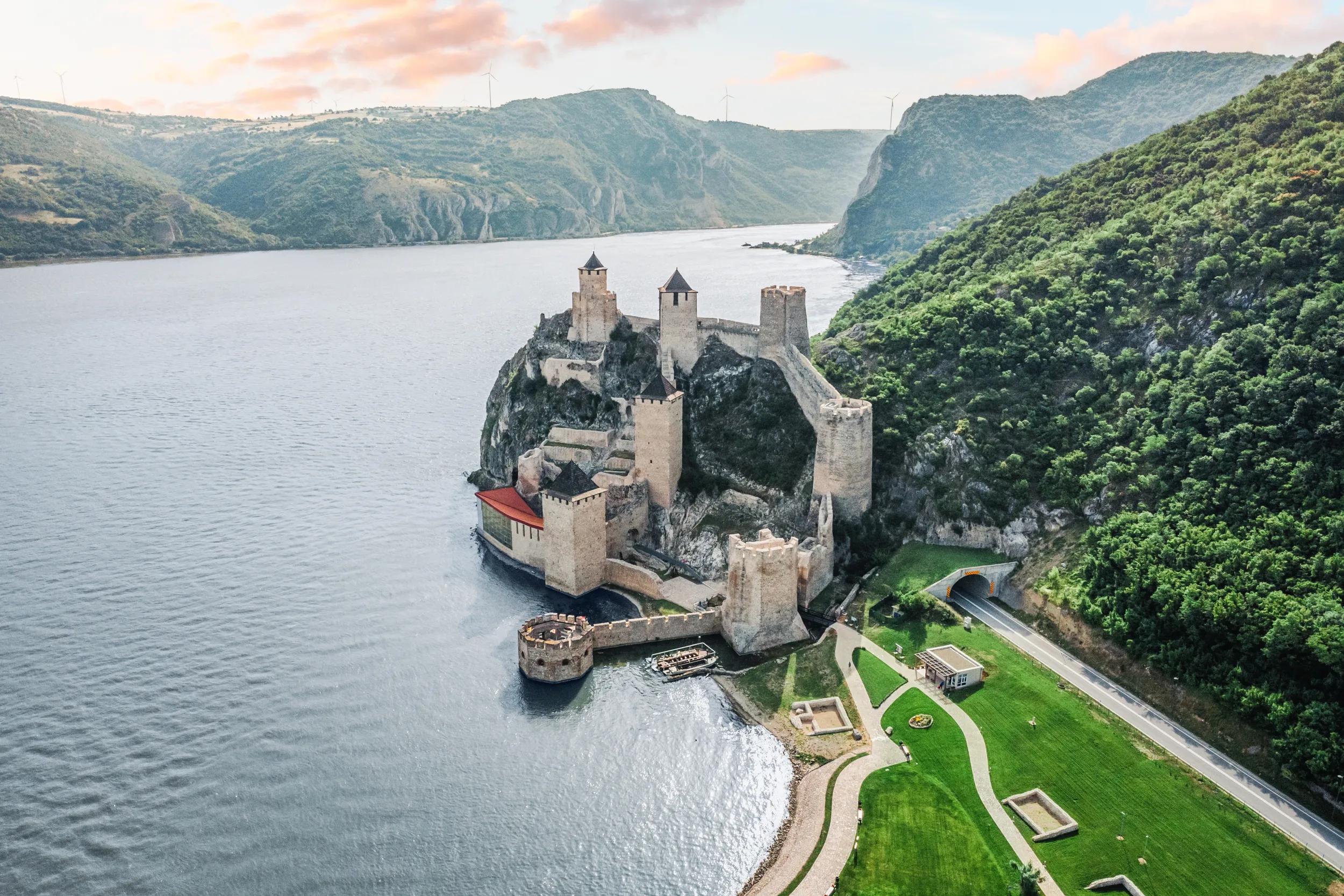 Aerial view of Golubac Fortress in Serbia, perched along the Danube River with its ancient stone towers and medieval architecture.