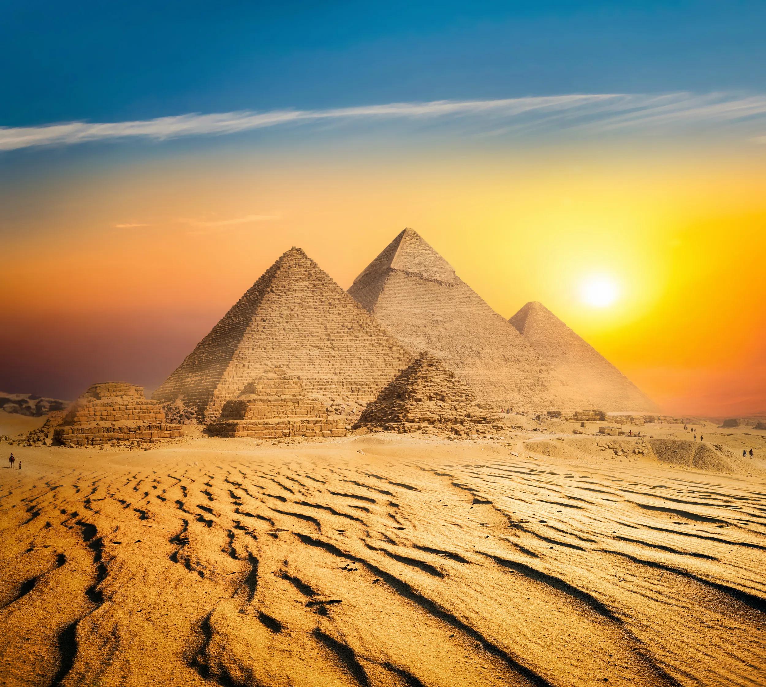 Egyptian pyramids in sand desert and clear sky