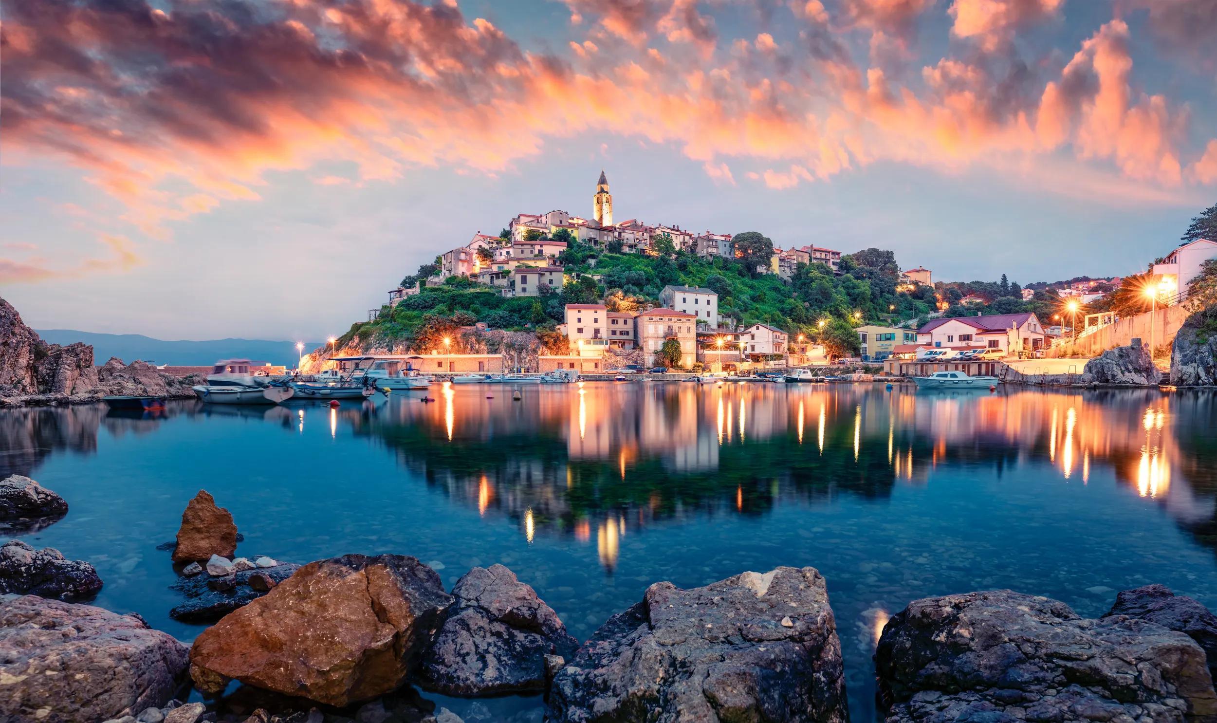 Breathtaking evening cityscape of Vrbnik town. Dramatic summer seascape of Adriatic sea, Krk island, Kvarner bay archipelago, Croatia, Europe. Beautiful world of Mediterranean countries.
