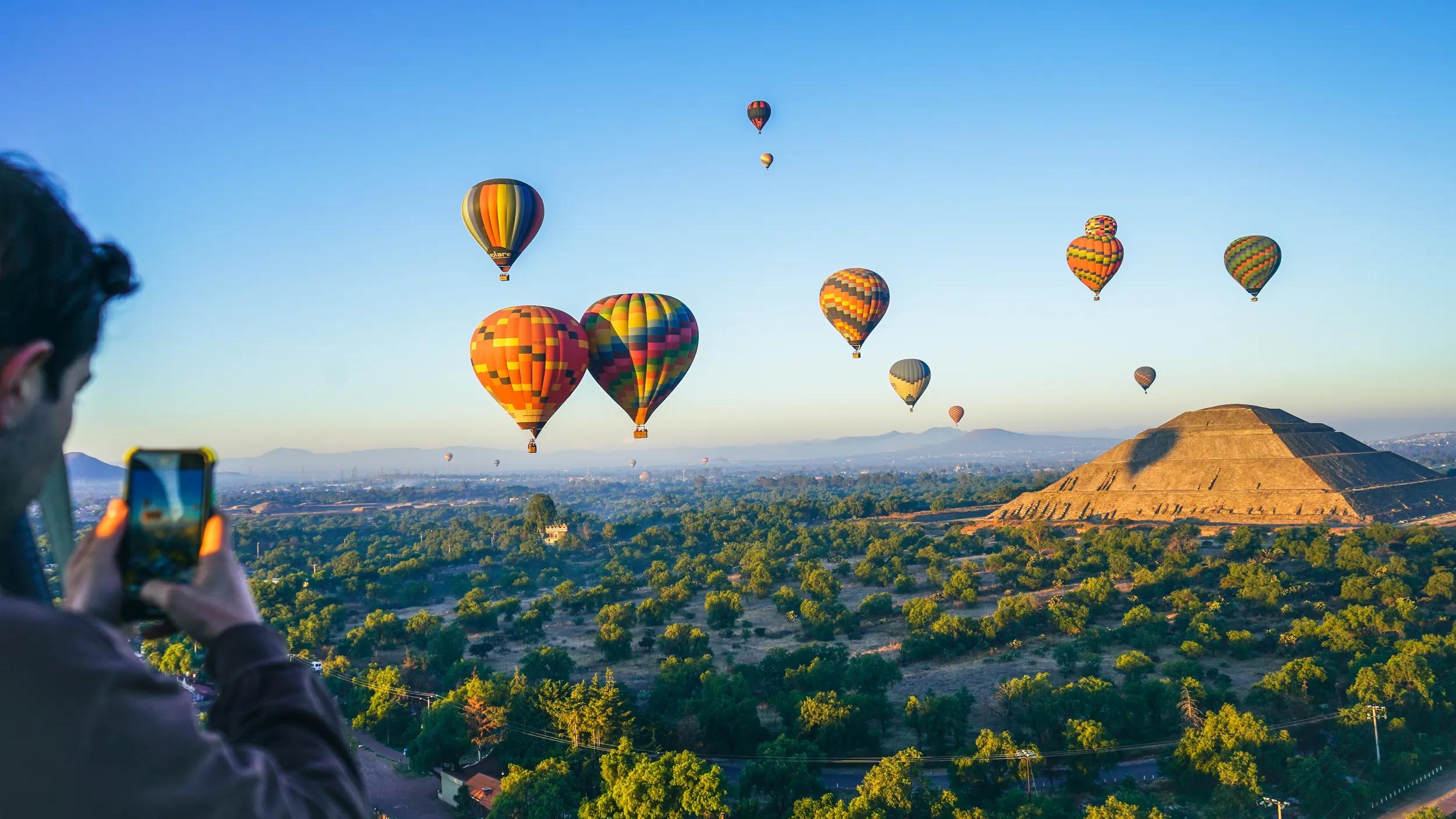 Hot air balloon over Teotihuacan pyramids