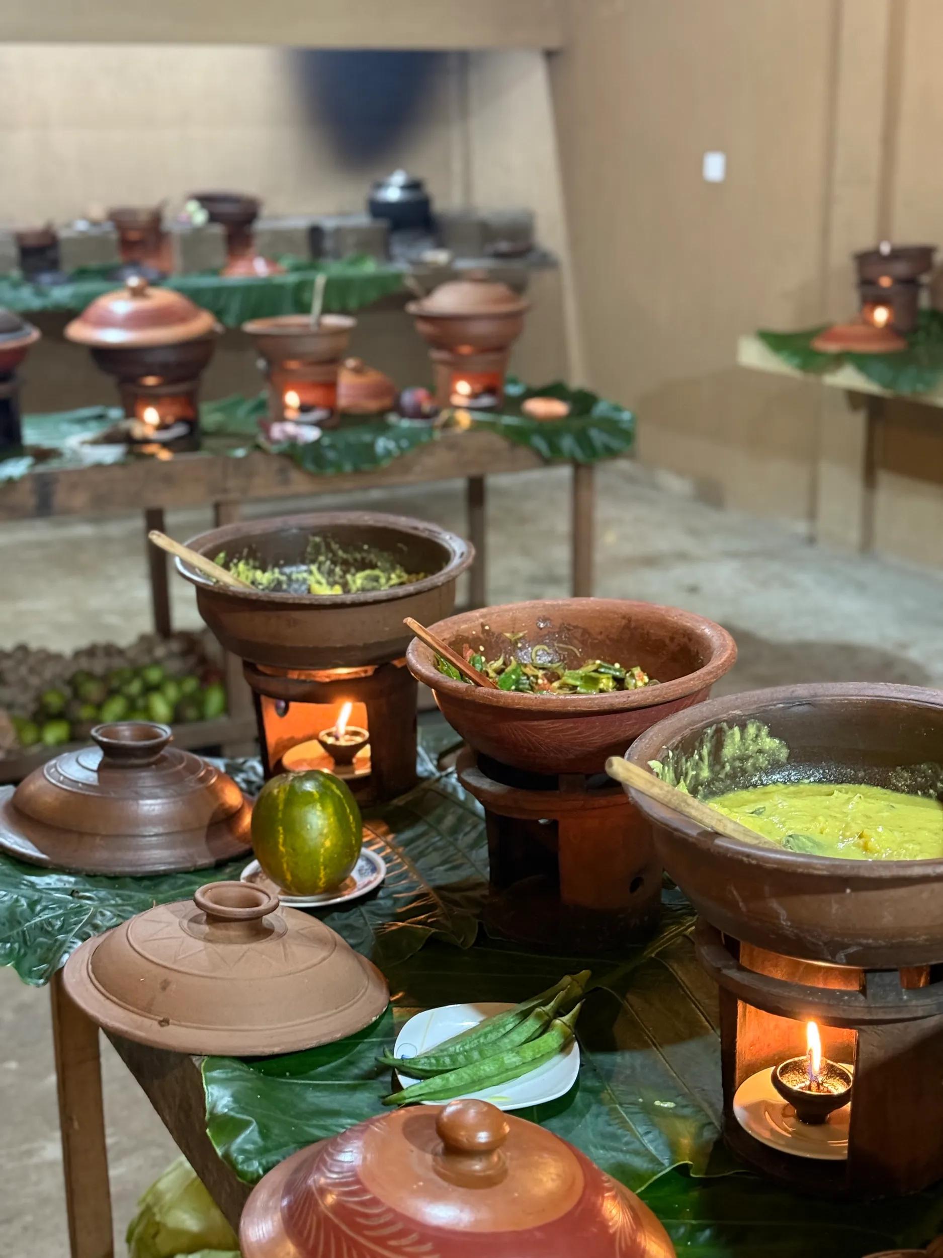 An assortment of traditional Sri Lankan curries served in rustic clay pots, showcasing rich spices and bold flavours, reflecting the island’s vibrant culinary heritage.