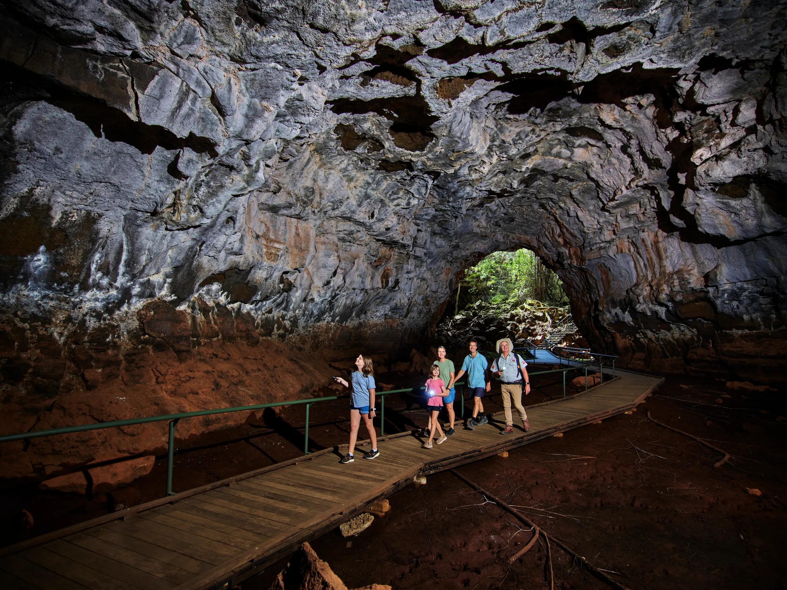 Family and guide looking at the Lava Tubes, while on the Undara Lava Tube Tour