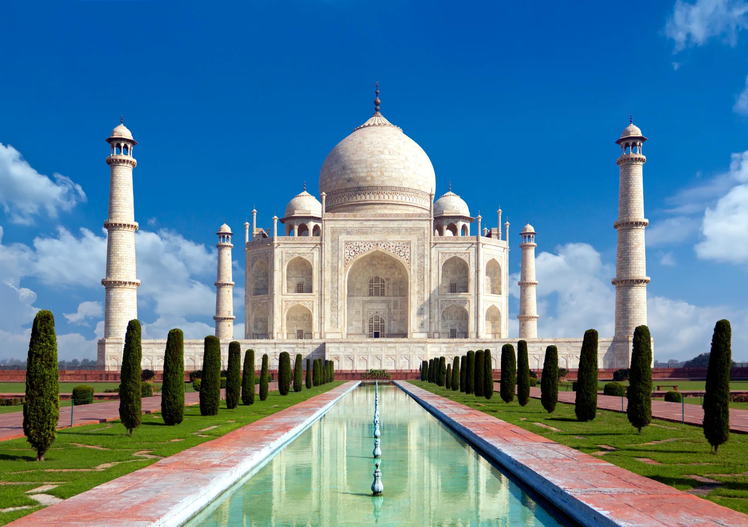 Taj mahal on a bright day in Agra, India - A monument of love in clear blue sky