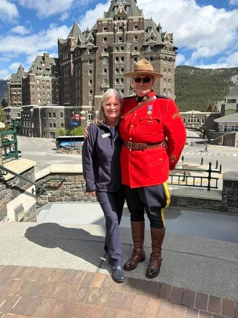 Mary SimpsonGalna and a Mountie outside Fairmont Banff Springs Hotel