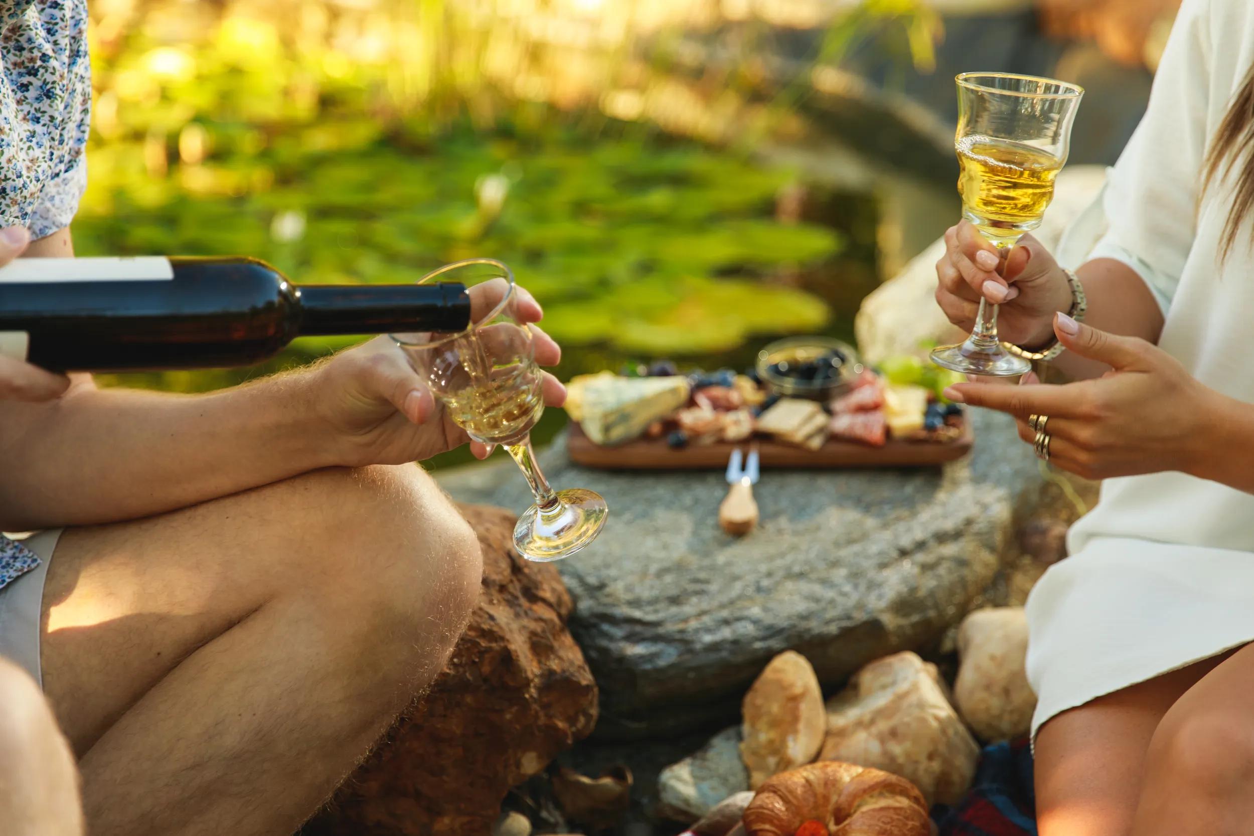 Young man and woman having a picnic outdoors